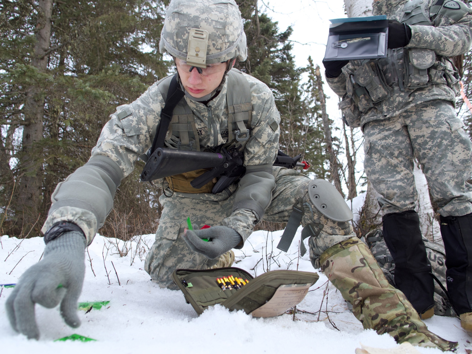 JOINT BASE ELMENDORF-RICHARDSON, Alaska -- Laramie Yancey, a junior-standing Army ROTC cadet from the University of Alaska Fairbanks, prepares a terrain model kit for an operations order April 4 during the University of Alaska Anchorage and UAF Joint Field Training Exercise at JBER's Camp Mad Bull. During their junior year, Army ROTC cadets learn how to lead at the squad and platoon level. (U.S. Air Force photo/David Bedard)