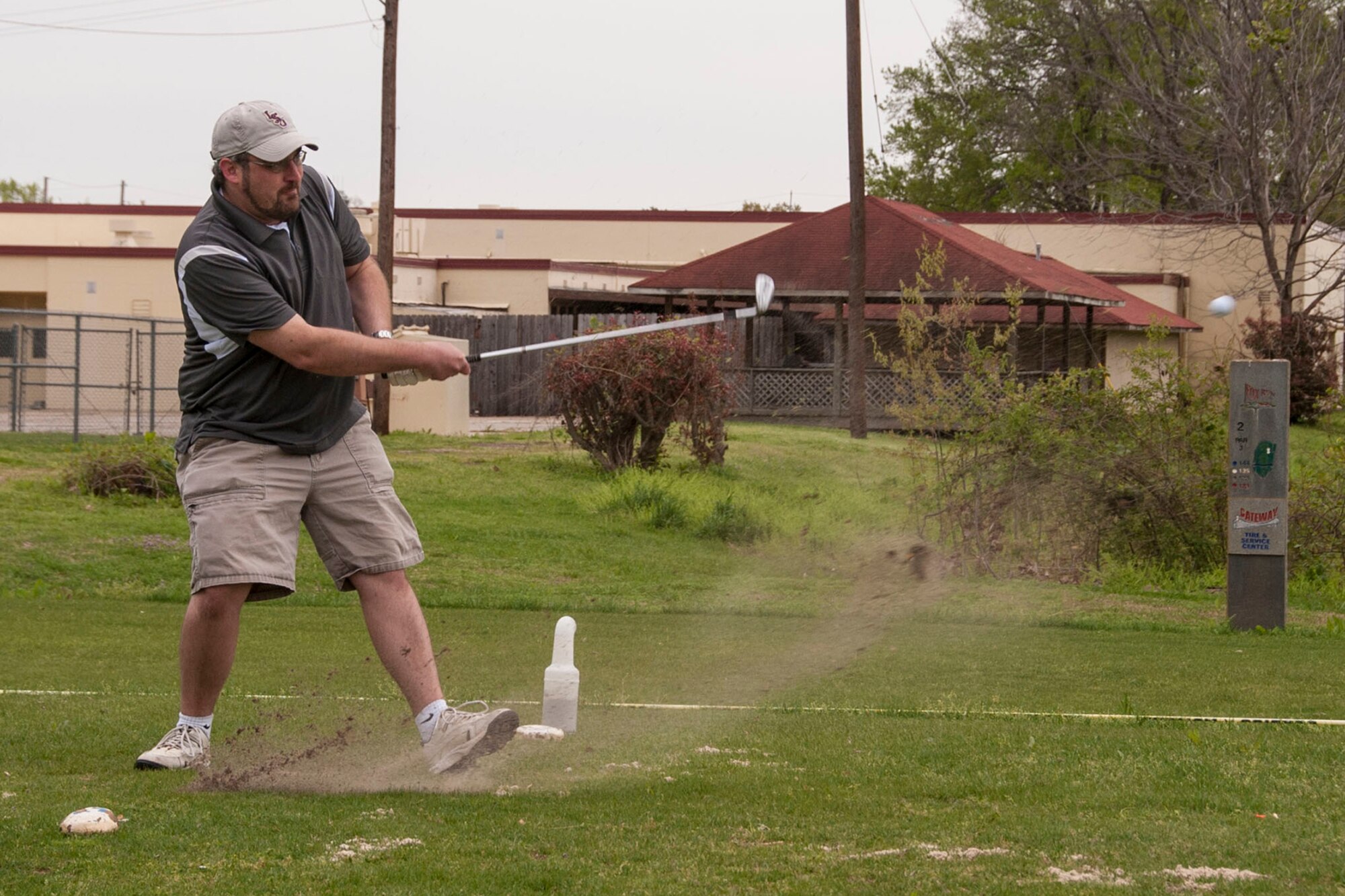 Ryan Wolfe creates a small divot during the 307th Bomb Wing Commander’s Cup Golf Tournament at the Fox Run Golf Course on Barksdale Air Force Base, La., April 5, 2014. The annual tournament is an opportunity for members, family and friends of the 307 BW to get together for some fun and camaraderie on the golf course. The tournament this year consisted of approximately 74 players making up 19 teams. (U.S. Air Force photo by Master Sgt. Jeff Walston/Released)