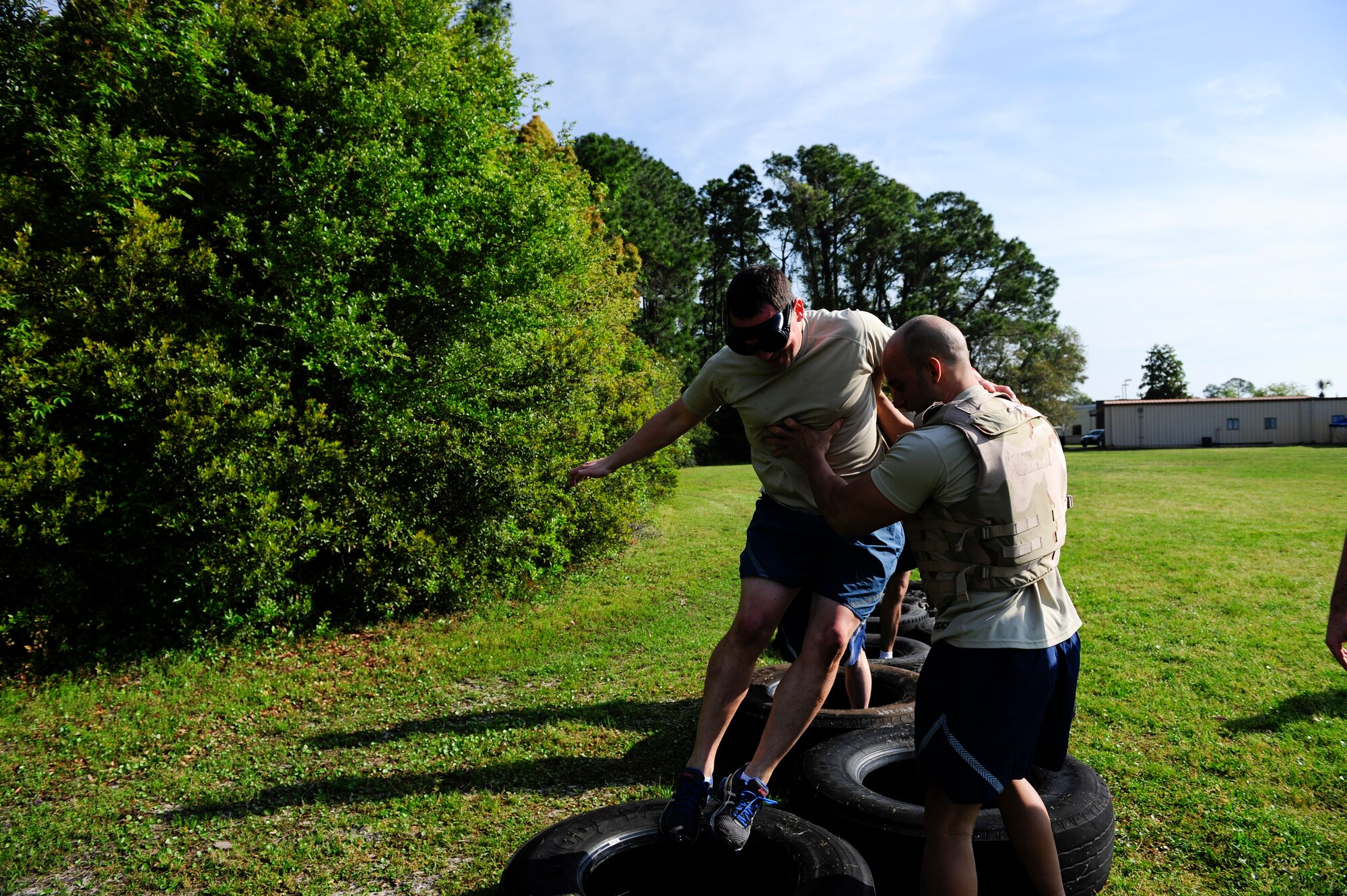 Airmen from the 1st Special Operations Security Forces Squadron participate in the CLEAR Challenge Obstacle Course on Hurlburt Field, Fla., April 11, 2014. The courses represented things that one may encounter in their personal and work life. (U.S. Air Force photo/Senior Airman Krystal M. Garrett)