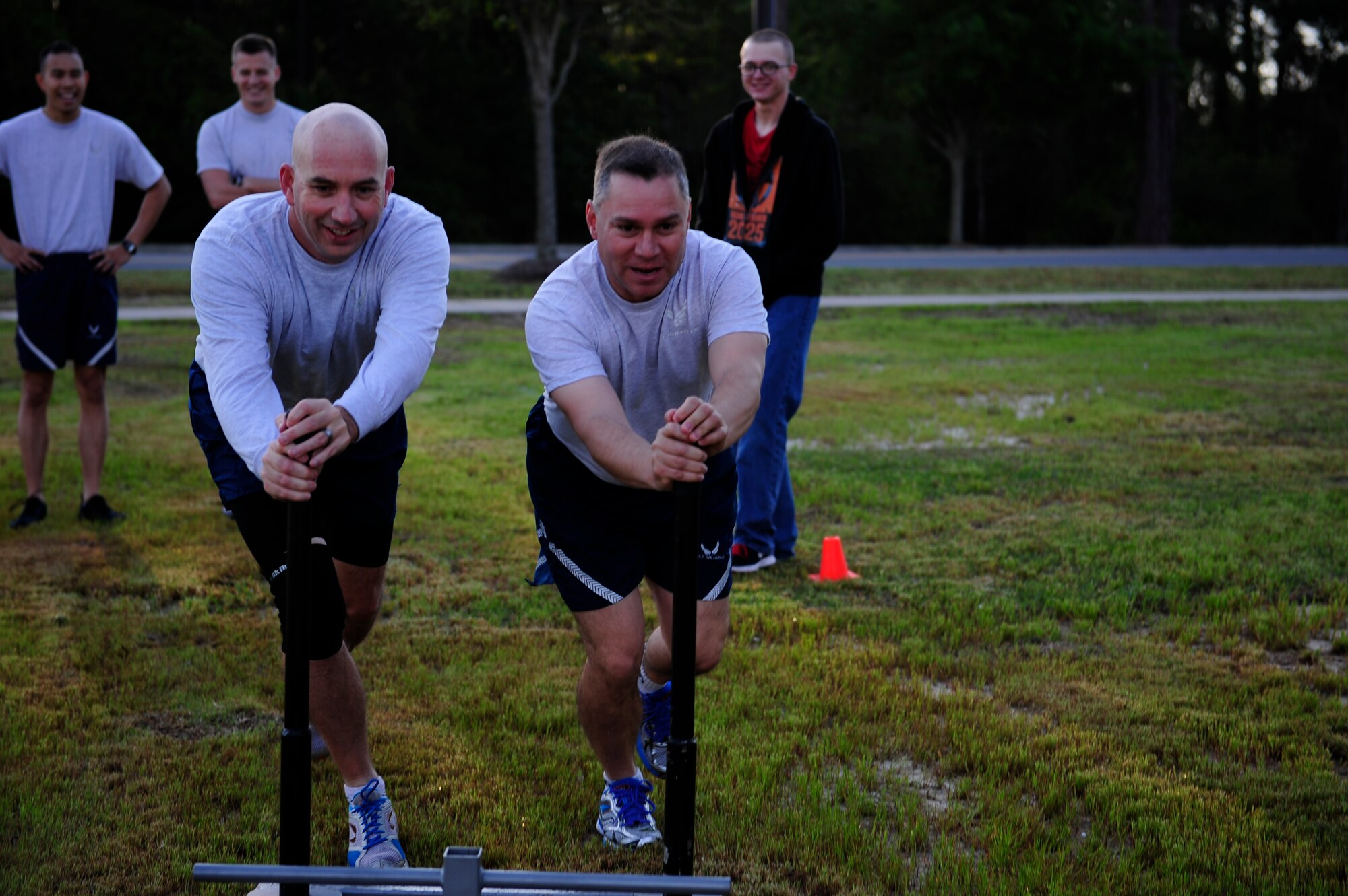 Chief Mater Sgt. Jeffery Maberry and Col. William Holt, 1st Special Operations Wing command chief and vice commander, participate in the CLEAR Challenge Obstacle Course on Hurlburt Field, Fla., April 11, 2014. Hurlburt Field members tested their resiliency during the course. (U.S. Air Force photo/Senior Airman Krystal M. Garrett)