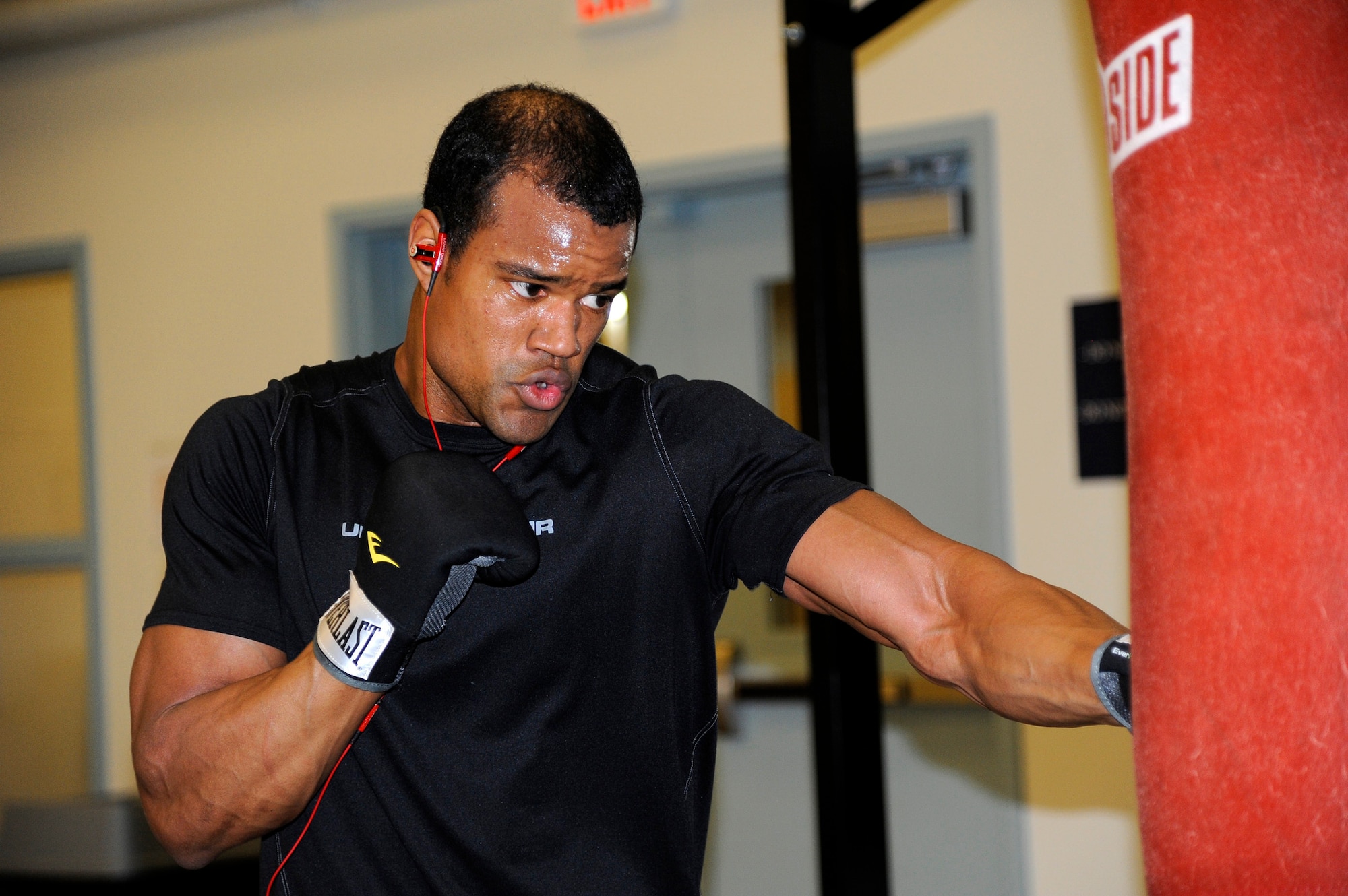 Staff Sgt. Patrice Dobson, 819th REDHORSE Squadron pavement and construction specialist, hones his boxing skills with a punching bag at Malmstrom’s Fitness Center on April 7. According to Airmen, having the opportunity to train in Malmstrom’s facility helps boost morale and is a great asset. (U.S. Air Force photo/Airman 1st Class Collin Schmidt)