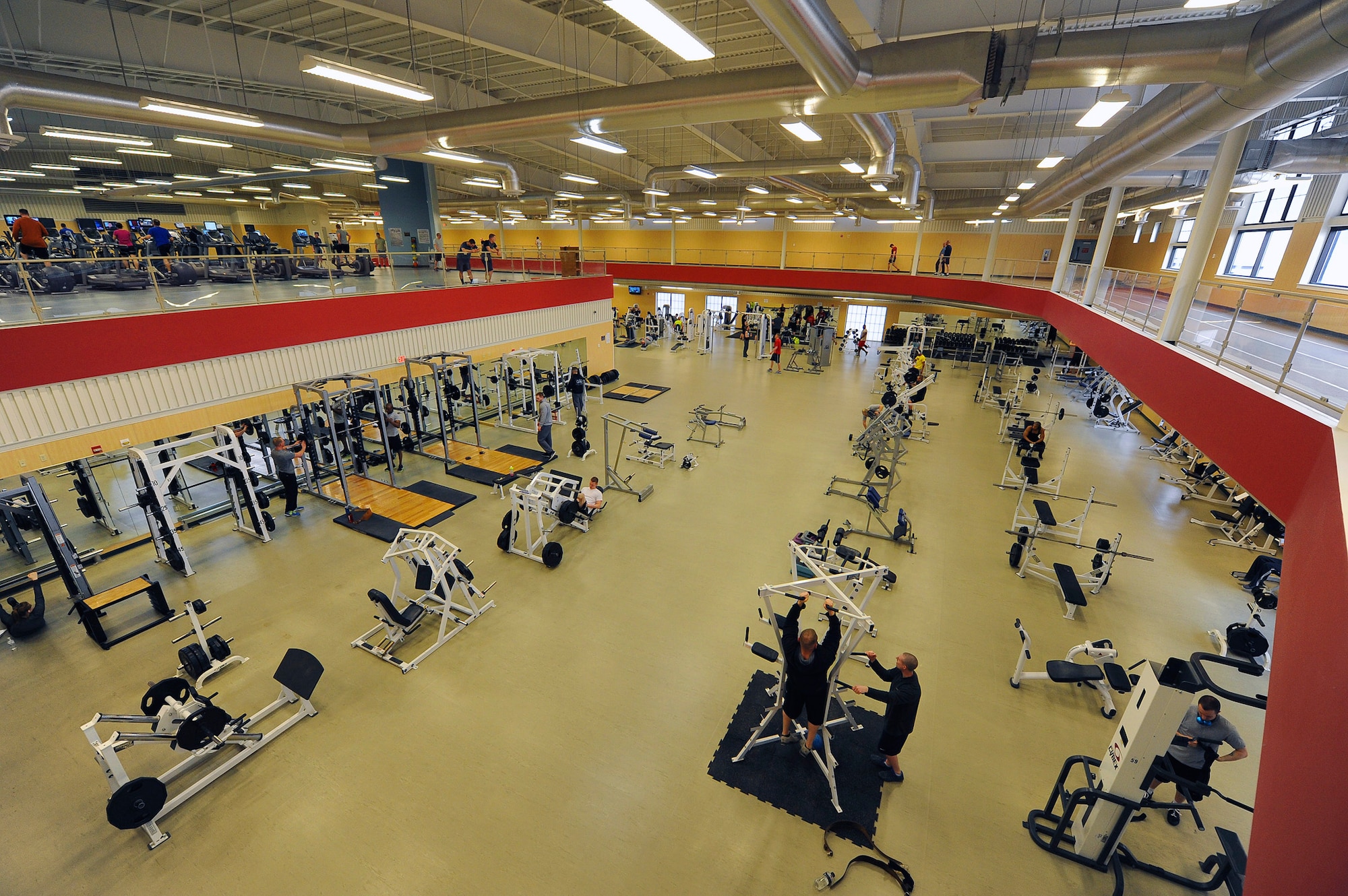 Team Malmstrom members utilize weight lifting and cardio equipment at Malmstrom’s Fitness Center April 7. Fitness center personnel provide daily maintenance on more than 100 fitness stations and machines. (U.S. Air Force photo/Airman 1st Class Collin Schmidt)