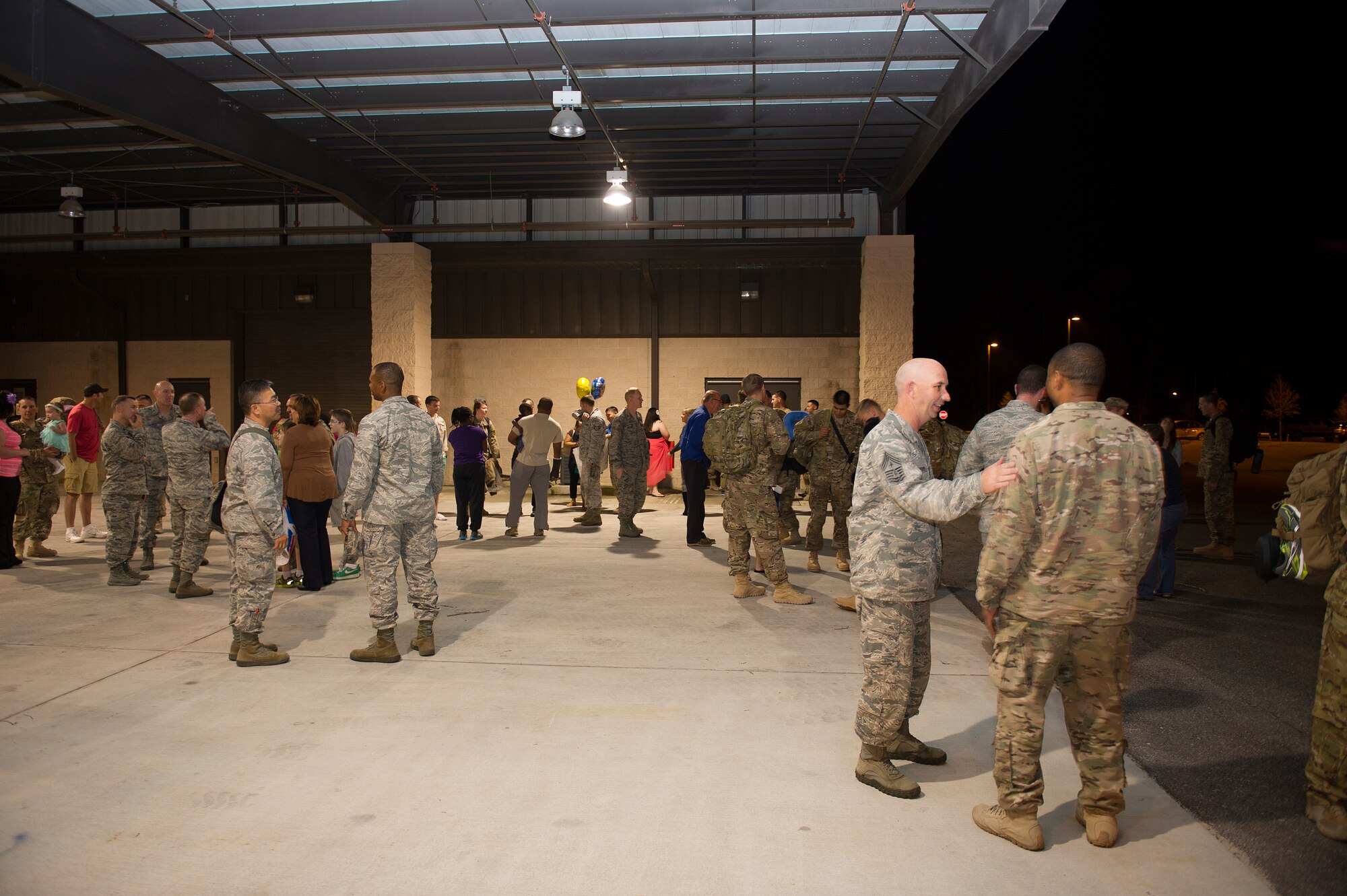 Families and Airmen welcome home their fellow Air Commandos during Operation Homecoming at the deployment control center, Hurlburt Field, Fla., April 10, 2014. Thirty-six Air Commandos returned home from deployment overseas. (U.S. Air Force photo/Airman 1st Class Jeff Parkinson)