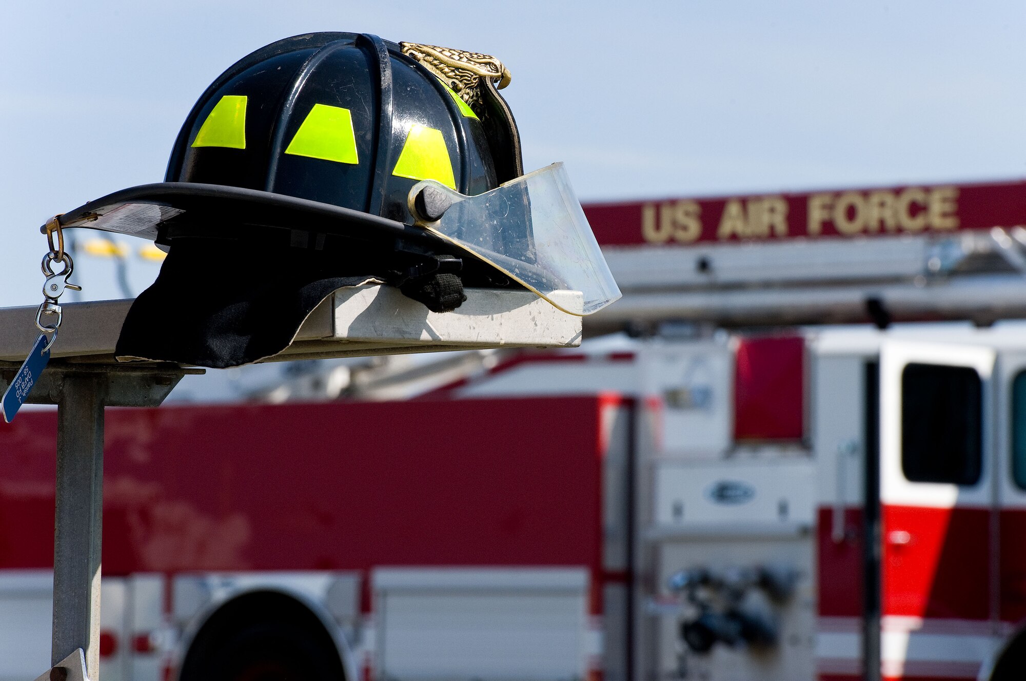 A 436th Civil Engineer Squadron Fire Department firefighter's helmet sits on a bleacher April 9, 2014, at the fire department training area on Dover Air Force Base, Del. Fire Dept. personnel received classroom training and practiced extinguishing structural and aircraft fires over four days. (U.S. Air Force photo/Roland Balik)