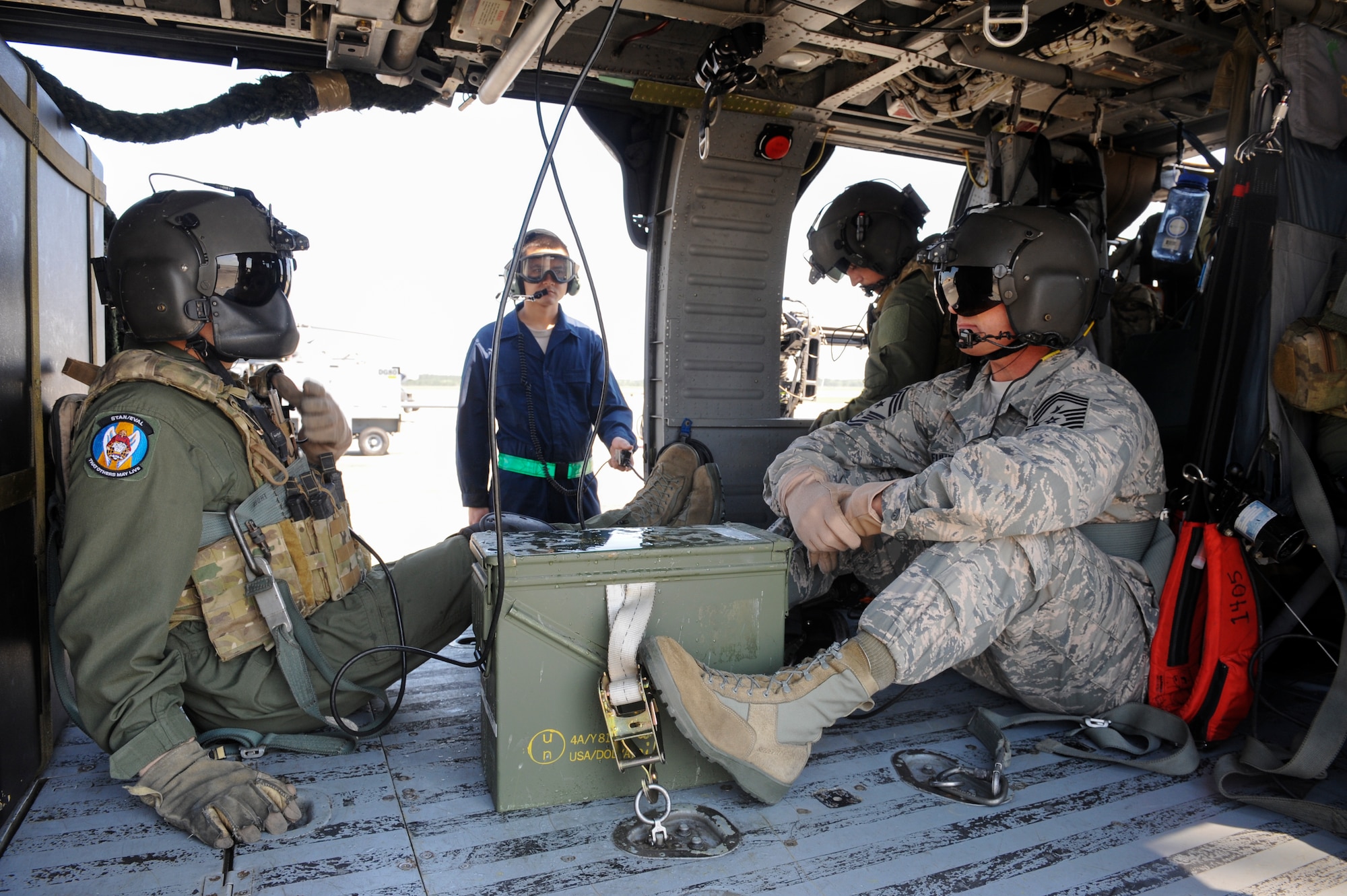 U.S. Air Force Master Sgt. William Nabakowski, 347th Rescue Group special missions aviation evaluator, briefs Chief Master Sgt. Scott Fuller, Ninth Air Force command chief, before takeoff at Moody Air Force Base, Ga., April 9, 2014. During his visit, Fuller had the opportunity to fly on an HH-60G Pave Hawk. (U.S. Air Force photo by Senior Airman Olivia Bumpers/Released)