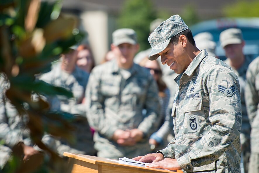 U.S. Air Force Senior Airman Charles Valcarcel, 823d Base Defense Squadron fire team member, shares memories during a tree planting ceremony in remembrance of Staff Sgt. Todd Lobraico Jr., at Moody Air Force Base, Ga., April 10, 2014. Valcarcel deployed alongside Lobraico in 2013 to Bagram Airfield, Afghanistan. (U.S. Air Force photo by Airman 1st Class Ryan Callaghan/Released)