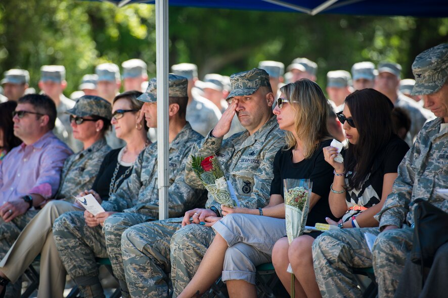U.S. Air Force Master Sgt. Todd Lobraico Sr., 105th Security Forces Squadron, wipes his eyes during a memorial dedication ceremony for his son, Staff Sgt. Todd Lobraico Jr., April 10, 2014, at Moody Air Force Base, Ga. Lobraico died Sept. 5, 2013, from wounds sustained when enemy forces attacked his unit with small-arms fire near Bagram Airfield, Afghanistan. (U.S. Air Force photo by Airman 1st Class Ryan Callaghan/Released)  