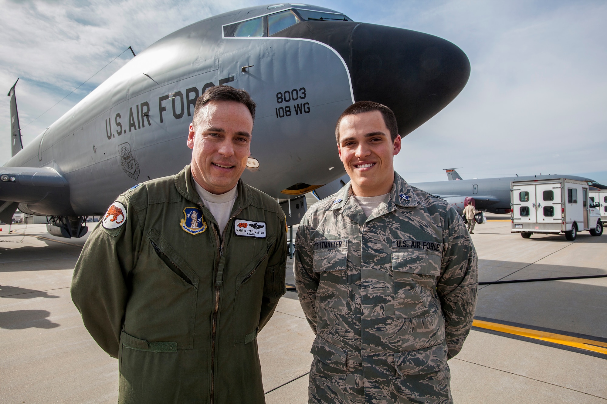 Lt. Col. Martin Strittmatter, left, 108th Wing pilot, and his son, Nick, pose for a photo in front of the KC-135 Stratotanker after the air refueling mission April 2, 2014. Nick, a sophmore at St. Joseph's University in Philadelphia, Pa., was among the 25 Air Force ROTC cadets that were invited to observe the air refueling mission. (U.S. Air National Guard photo by Master Sgt. Mark C. Olsen/Released)