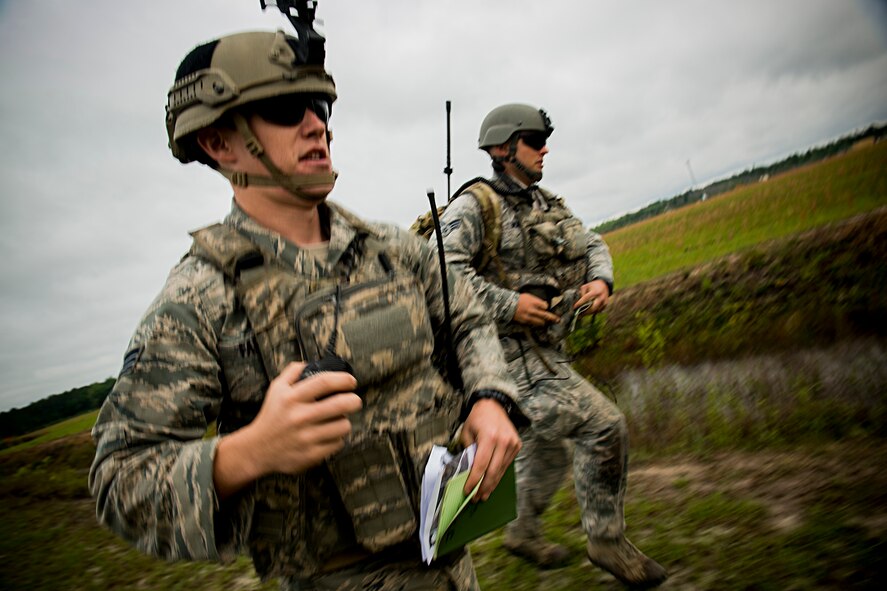 U.S. Air Force Senior Airmen Jim Farrell (left) and Shawn Morgan, 15th Air Support Operations Squadron joint terminal attack controllers (JTAC) out of Fort Stewart, Ga., run to better position during a close air support training mission April 8, 2014, at Moody Air Force Base, Ga. To remain qualified and proficient at what they do, JTACs regularly train and direct airstrikes in simulated situations. (U.S. Air Force photo by Staff Sgt. Jamal D. Sutter/Released)  