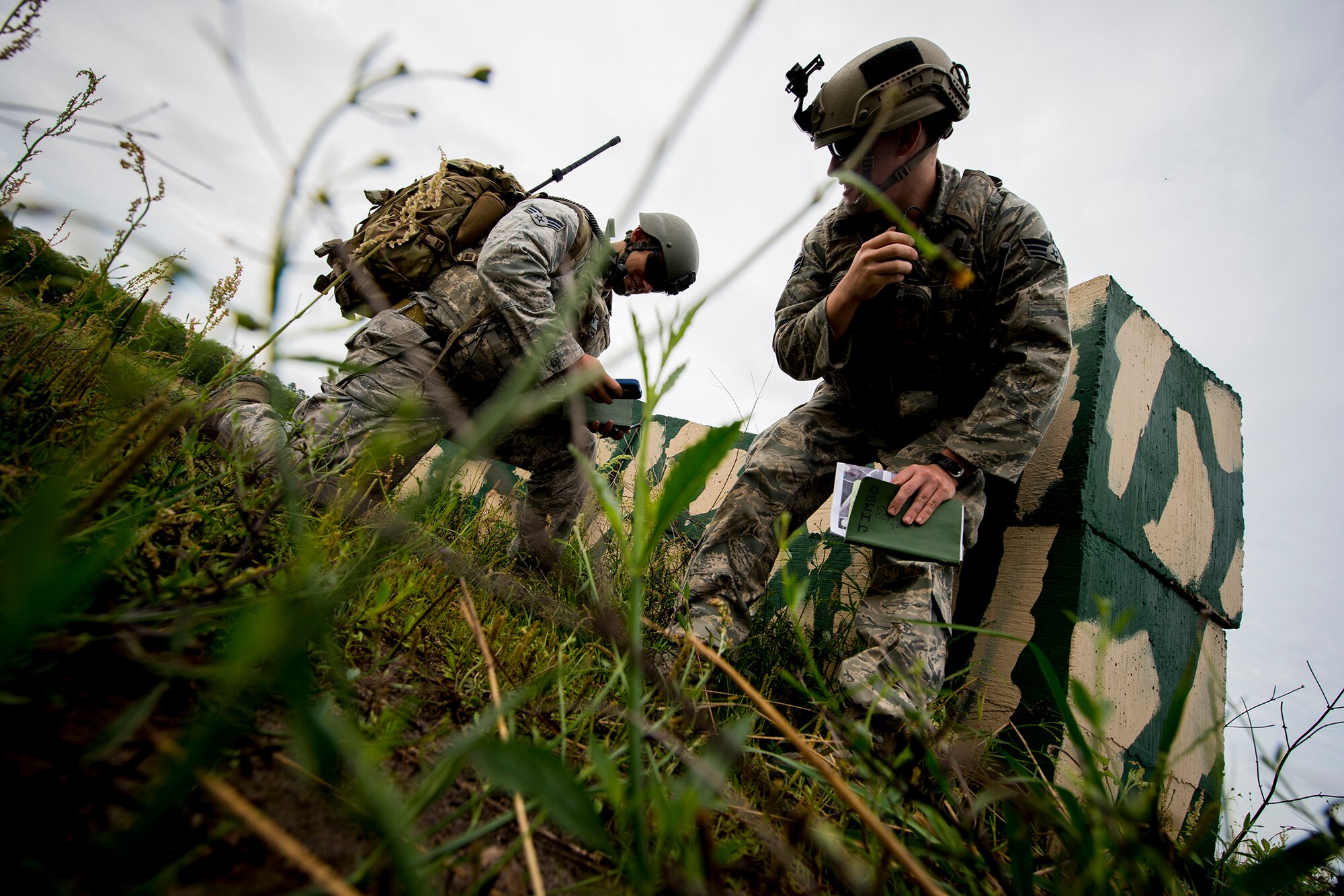 U.S. Air Force Senior Airmen Jim Farrell (right) and Shawn Morgan, 15th Air Support Operations Squadron joint terminal attack controllers out of Fort Stewart, Ga., prepare to assist an airstrike during a close air support training mission April 8, 2014, at Moody Air Force Base, Ga. The Airmen conducted the mission with two F-16 Fighting Falcons piloted by Maj. Gen. Jake Polumbo, Ninth Air Force commander, and Capt. Mike Chebino, 9th AF aide-da-camp. (U.S. Air Force photo by Staff Sgt. Jamal D. Sutter/Released)  