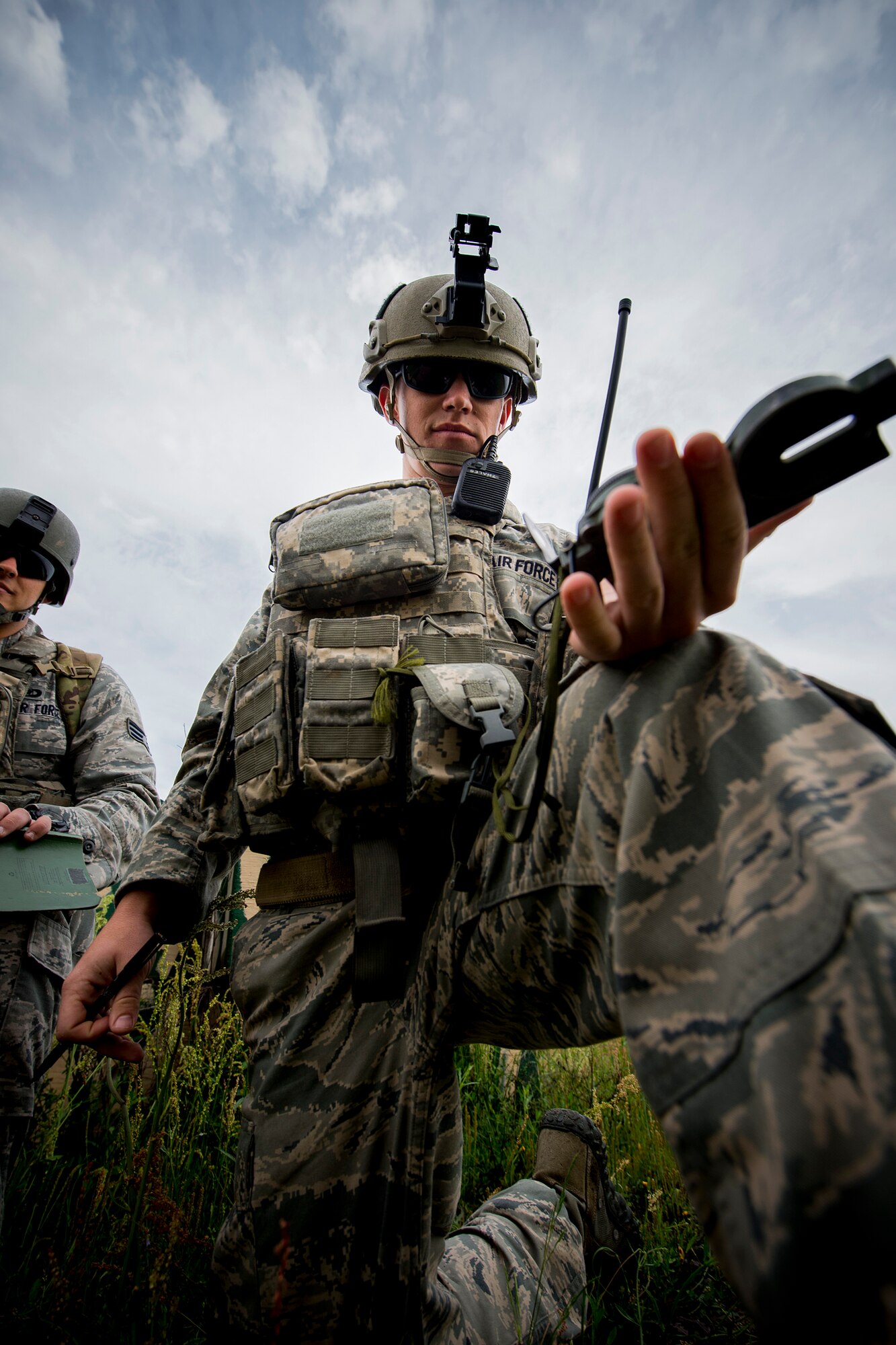 U.S. Air Force Senior Airman Jim Farrell, 15th Air Support Operations Squadron joint terminal attack controller (JTAC) out of Fort Stewart, Ga., checks a compass during a close air support training mission April 8, 2014, at Moody Air Force Base, Ga. JTACs communicate with pilots as their ‘eyes-on-ground’ to help direct airstrikes on enemies and their assets. (U.S. Air Force photo by Staff Sgt. Jamal D. Sutter/Released)  