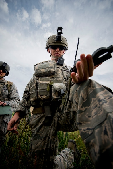 U.S. Air Force Senior Airman Jim Farrell, 15th Air Support Operations Squadron joint terminal attack controller (JTAC) out of Fort Stewart, Ga., checks a compass during a close air support training mission April 8, 2014, at Moody Air Force Base, Ga. JTACs communicate with pilots as their ‘eyes-on-ground’ to help direct airstrikes on enemies and their assets. (U.S. Air Force photo by Staff Sgt. Jamal D. Sutter/Released)  