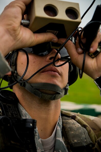 U.S. Air Force Senior Airman Shawn Morgan, 15th Air Support Operations Squadron joint terminal attack controller (JTAC) out of Fort Stewart, Ga., calibrates a pocket laser rangefinder April 8, 2014, at Moody Air Force Base, Ga. JTACs use rangefinders to determine the distance to and direction of an object. (U.S. Air Force photo by Staff Sgt. Jamal D. Sutter/Released) 