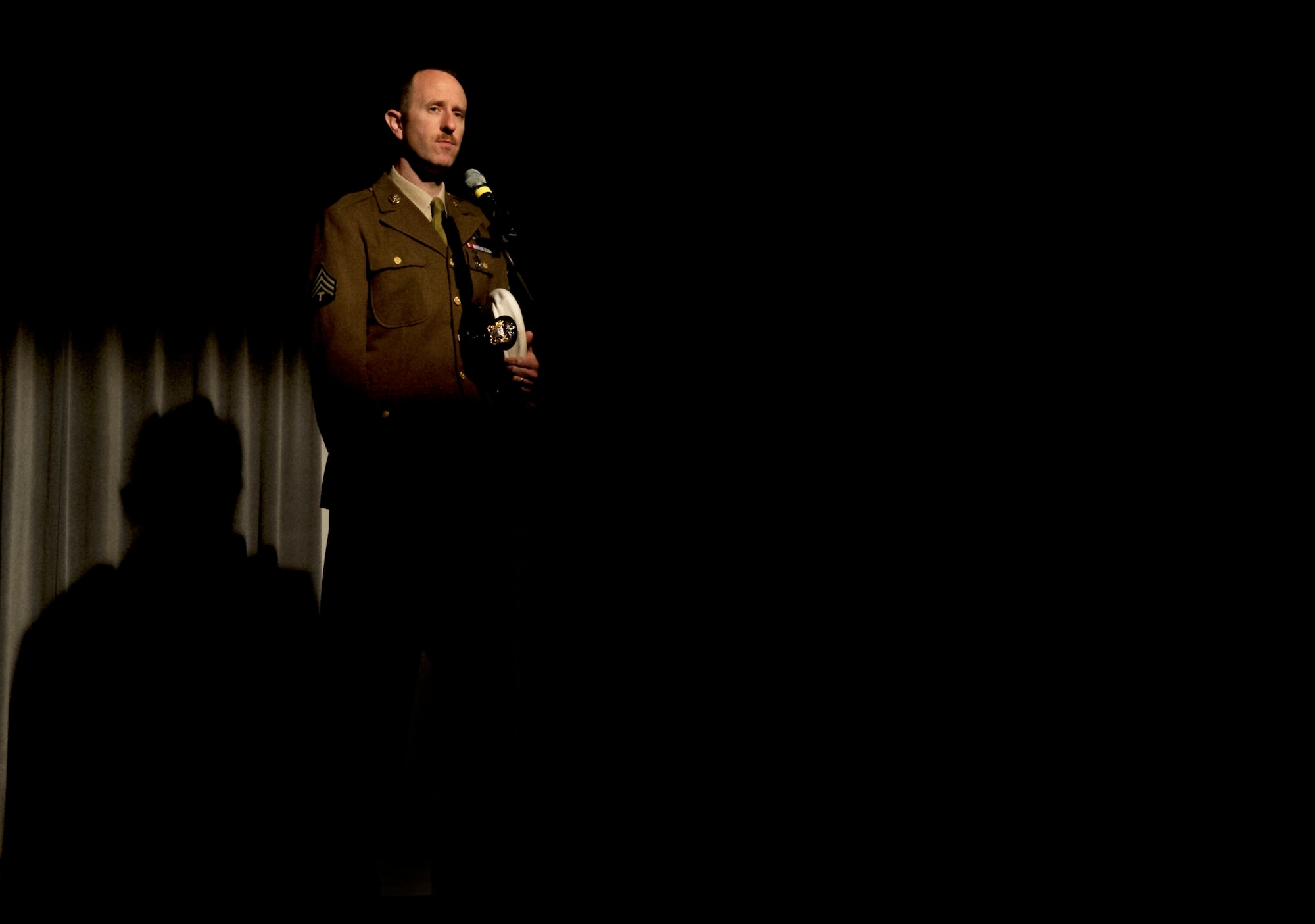As part of the “Spirits of the Past” production, Master Sgt. Bruce Haskin, Kisling director of resources, talks about being in the military during World War II April 3, 2014 at Kapaun Air Station, Germany. Each instructor gave a speech about the struggles and lives lost during the six wars represented. (U.S. Air Force photo/ Airman Larissa Greatwood)