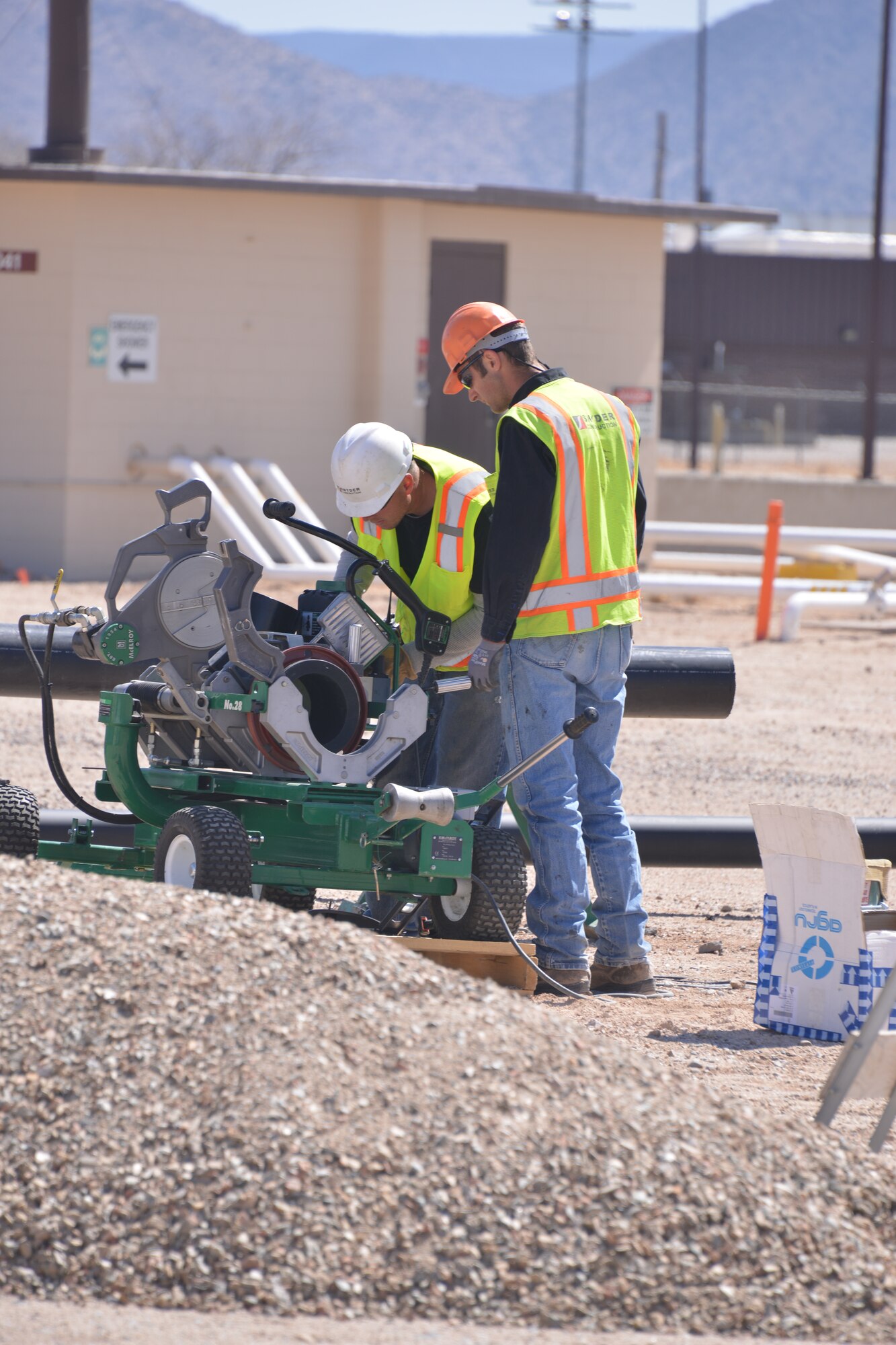 Crews lay a pipeline to connect a CATOX, or catalytic oxidizer, to a well head a the fuel plume. A CATOX pulls contaminants from the soil and destroys them in a 1,000-degree converter. (Photo by Todd Berenger)