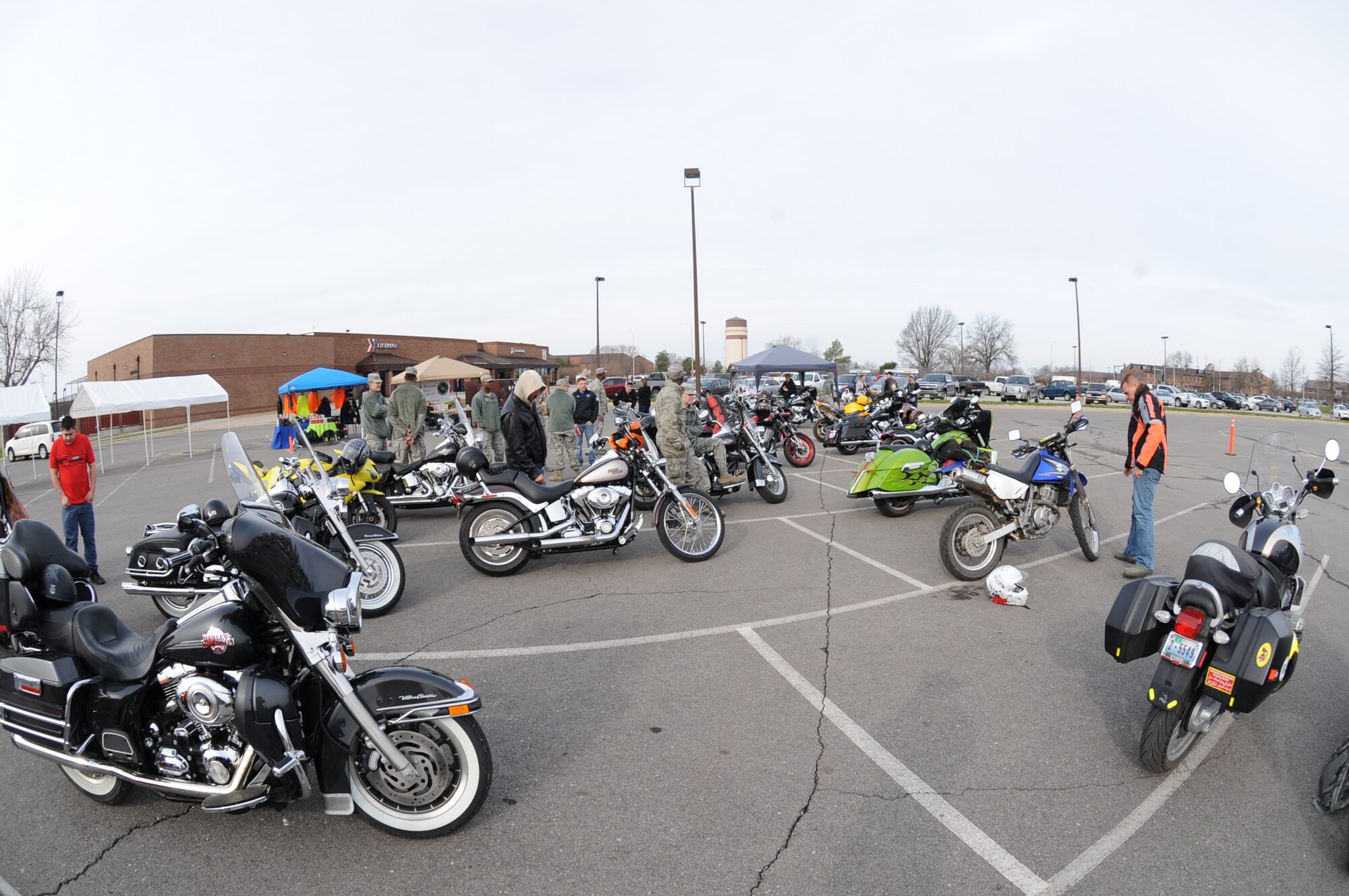 Motorcyclists and motorcycle enthusiasts socialize and look at the different motorcycles on display at the annual Motorcycle Awareness and Safety Day at Whiteman Air Force Base, Mo., April 7, 2014. First-time riders, seasoned veterans and anyone who enjoys motorcycles were encouraged to come out and learn about motorcycle safety. (U.S. Air Force photo by Airman 1st Class Joel Pfiester/Released)