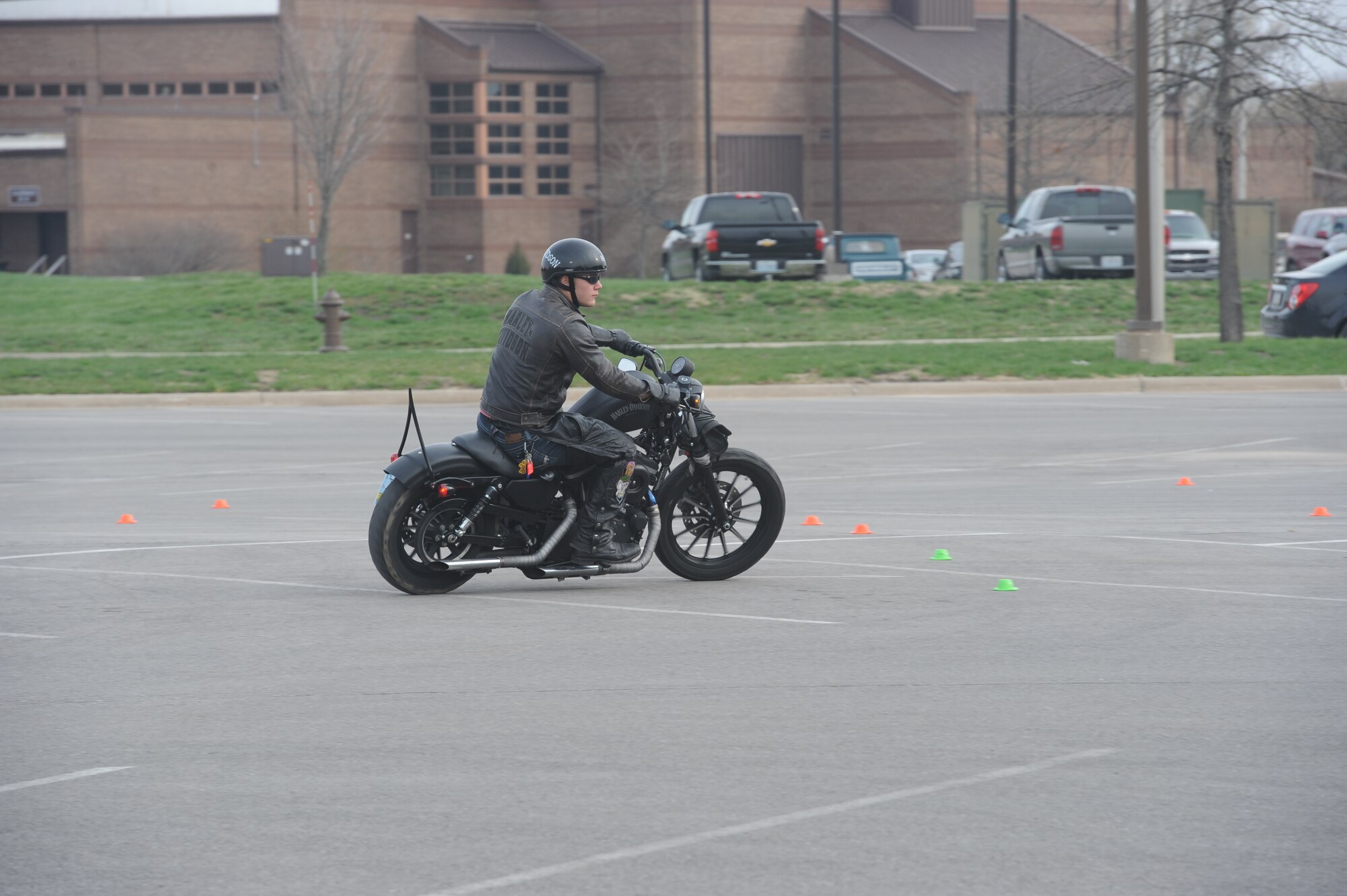 Airman 1st Class Justin Christoff, 509th Munitions Squadron, Conventional Maintenance Section, negotiates the obstacle course during a warm-up ride in the Commissary parking lot at Whiteman Air Force Base, Mo., April 7, 2014. The course was called Grant’s Gauntlet. (U.S. Air Force photo by Airman 1st Class Joel Pfiester/Released)