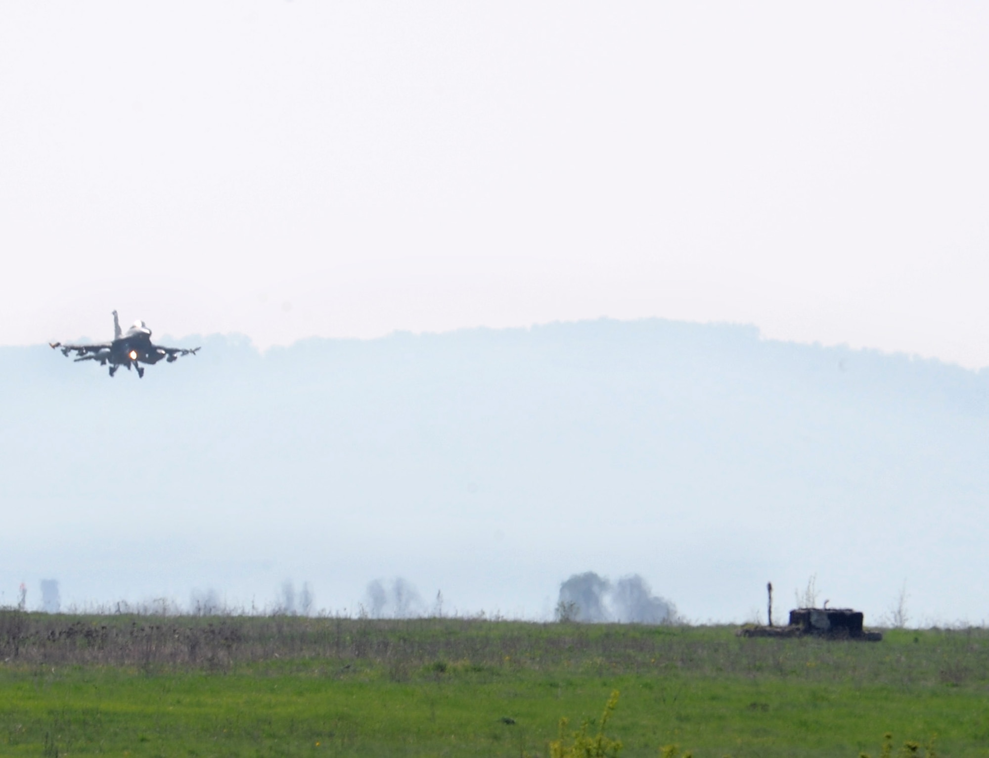 An F-16 Fighting Falcon arrives at Campia Turzii, Romania, April 9, 2014, for Dacian Viper 2014. The exercise aims to enhance interoperability and readiness through combined air operations, including air-to-air, air-to-ground and joint tactical air controller training. (U.S. Air Force photo/Staff Sgt. R.J. Biermann) 