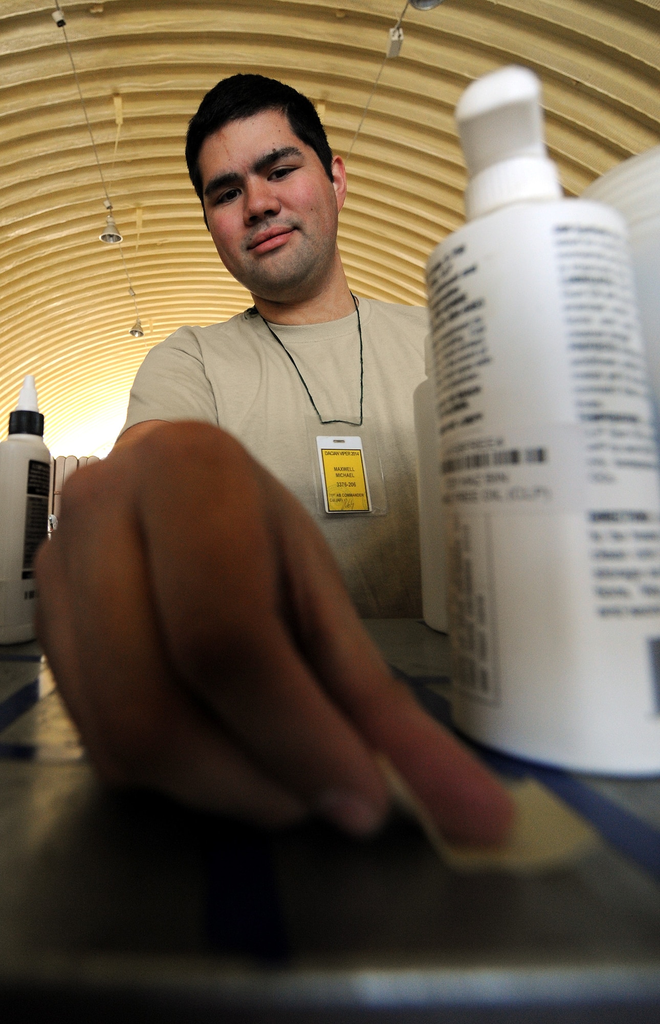 Senior Airman Michael Maxwell, 31st Aircraft Maintenance Squadron support technician, catalogs hazardous materials in an aircraft hangar at Campia Turzii, Romania, April 9, 2014. The support section provides flightline personnel with tools and equipment needed to fulfill mission requirements. (U.S. Air Force photo/Staff Sgt. R.J. Biermann)