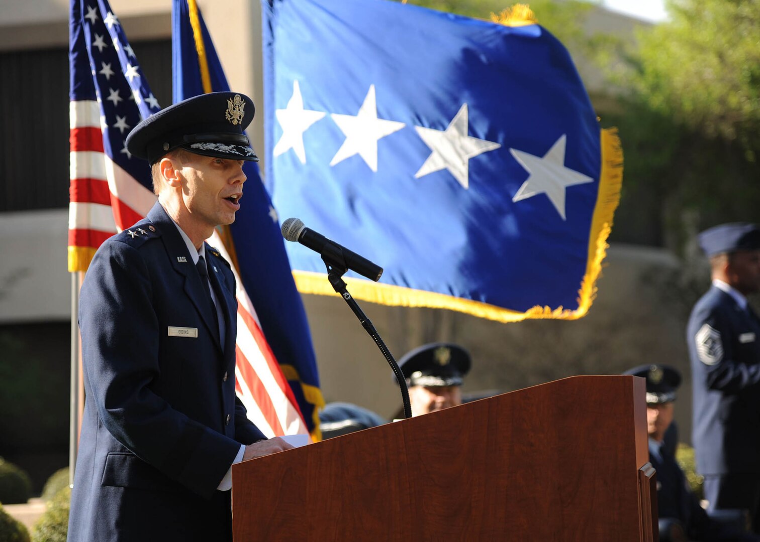 Maj. Gen. Bart Iddins, 59th Medical Wing commander and San Antonio Military Health System deputy market manager, addresses the audience after taking command of the unit during an April 10 ceremony at the Wilford Hall Ambulatory Surgical Center, Joint Base San Antonio-Lackland, Texas. Iddins replaces a retiring Maj. Gen. Byron Hepburn, who led the 59th MDW through its integration with Army medical services as part of the new San Antonio Military Health System. The 59th MDW is comprised of more than 6,000 personnel who provide medical services to nearly 240,000 beneficiaries in the San Antonio metropolitan area. (U.S. Air Force photo/Staff Sgt. Jerilyn Quintanilla)