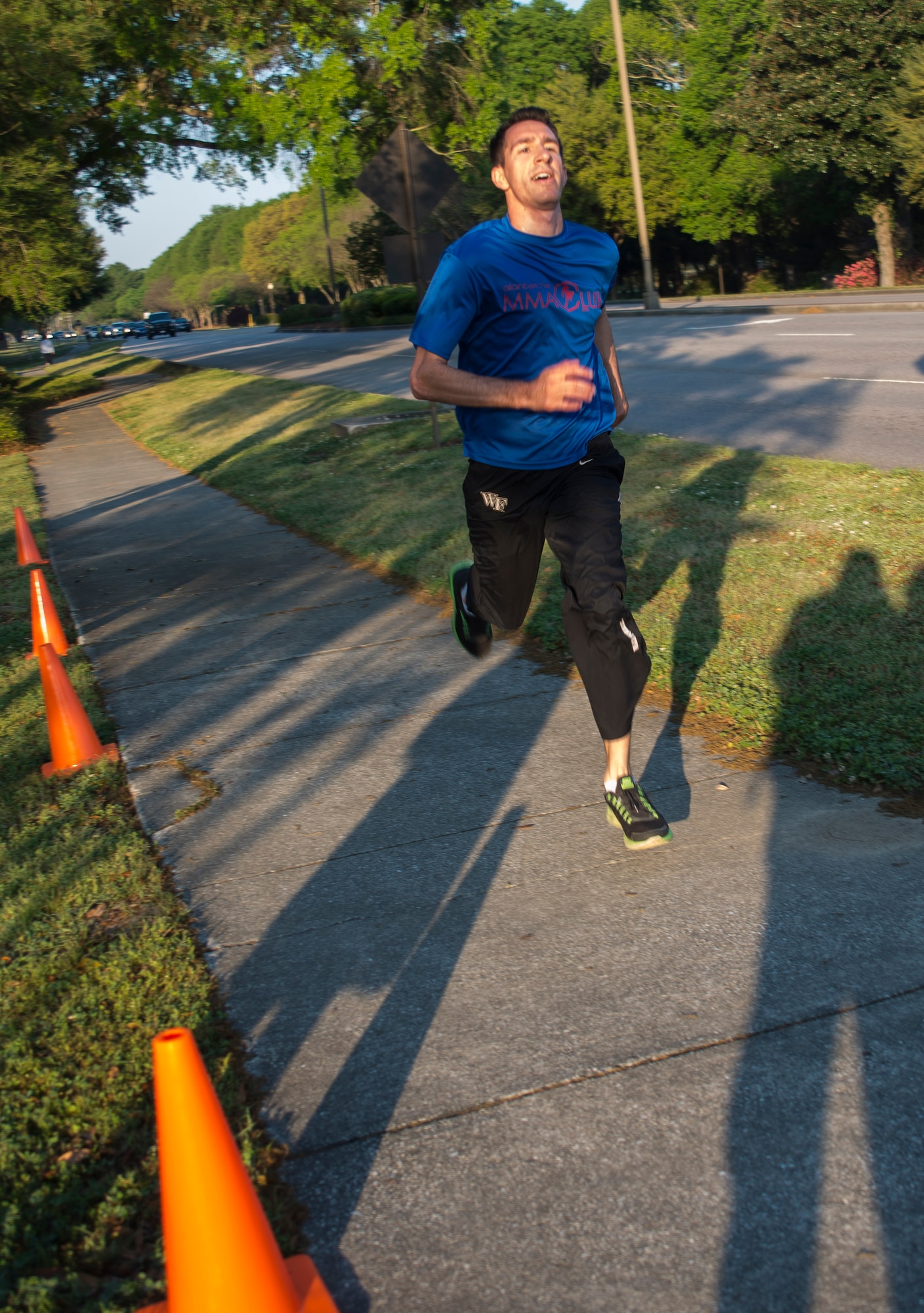 Airman 1st Class Anthony Tressel, 628th Communications Squadron radio frequency transmission systems technician, sprints to the finish line during the 5K Fitness Challenge Run Apr. 11, 2014, on Joint Base Charleston – Air Base, S.C. The Fitness Challenge is held monthly to test Team Charleston’s fitness abilities. Tressel was the top male runner with a time of 18:12. (U.S. Air Force photo/ Airman 1st Class Clayton Cupit)