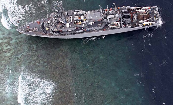 The mine countermeasures ship USS Guardian (MCM 5) is seen in this photo released Thursday Jan. 17, 2013, by the Armed Forces of the Philippines Western Command after running aground off Tubbataha Reef. The reef is about 400 nautical miles southwest of Manila, Philippines. (U.S. Navy photo courtesy of the Armed Forces of the Philippines Western Command)