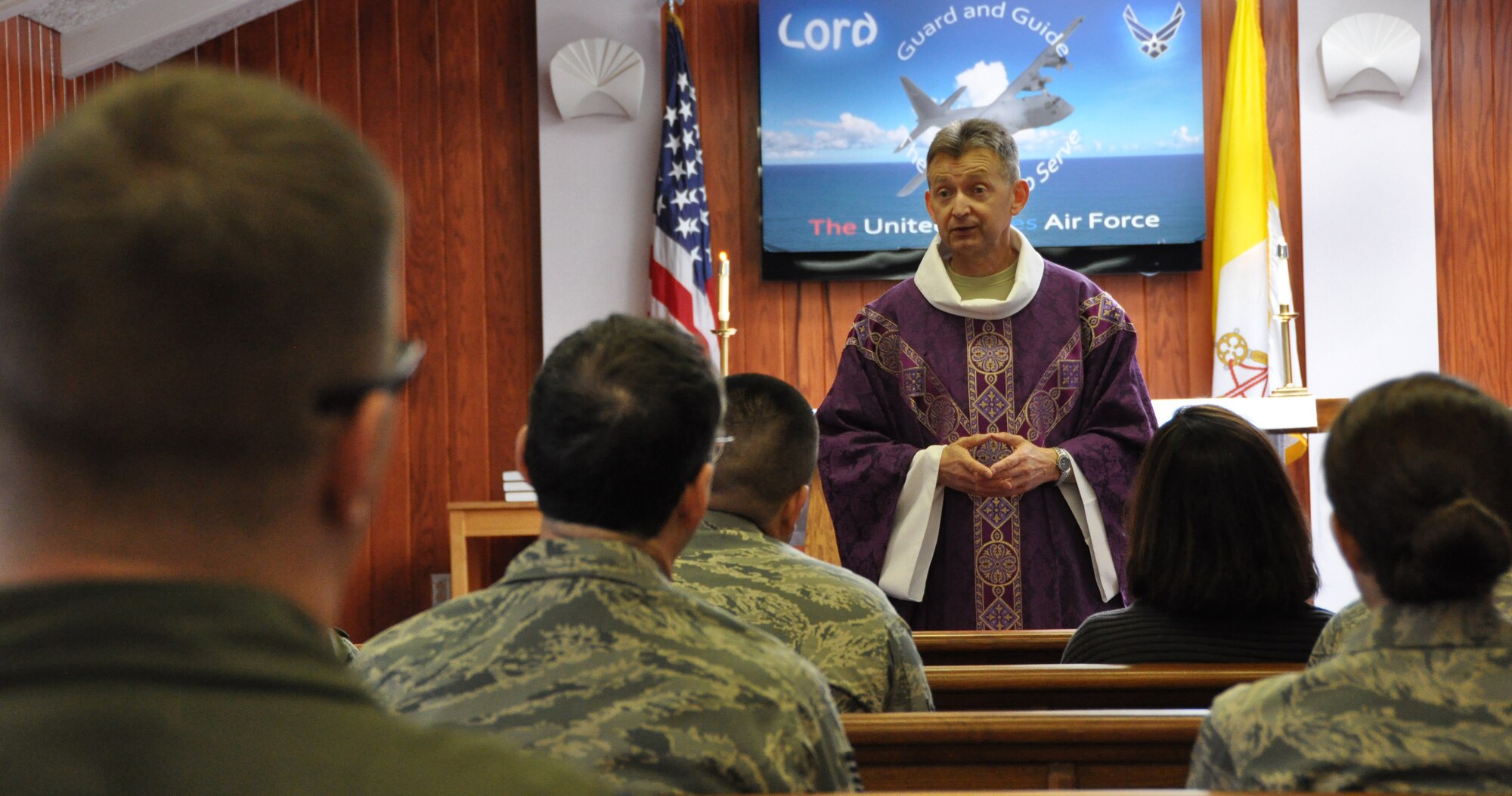 Maj. Zenon Bochnak, chaplain of the Pittsburgh International Airport Air Reserve Station, conducts Catholic services for members of the 911th Airlift Wing, April 6, 2014. While his path to the Air Force was quite different from most, to him it was a calling. Now, after a long active duty career, Bochnak has come to the 911th AW to serve as the base chaplain. (U.S. Air Force photo by Senior Airman Joseph E. Bridge)
