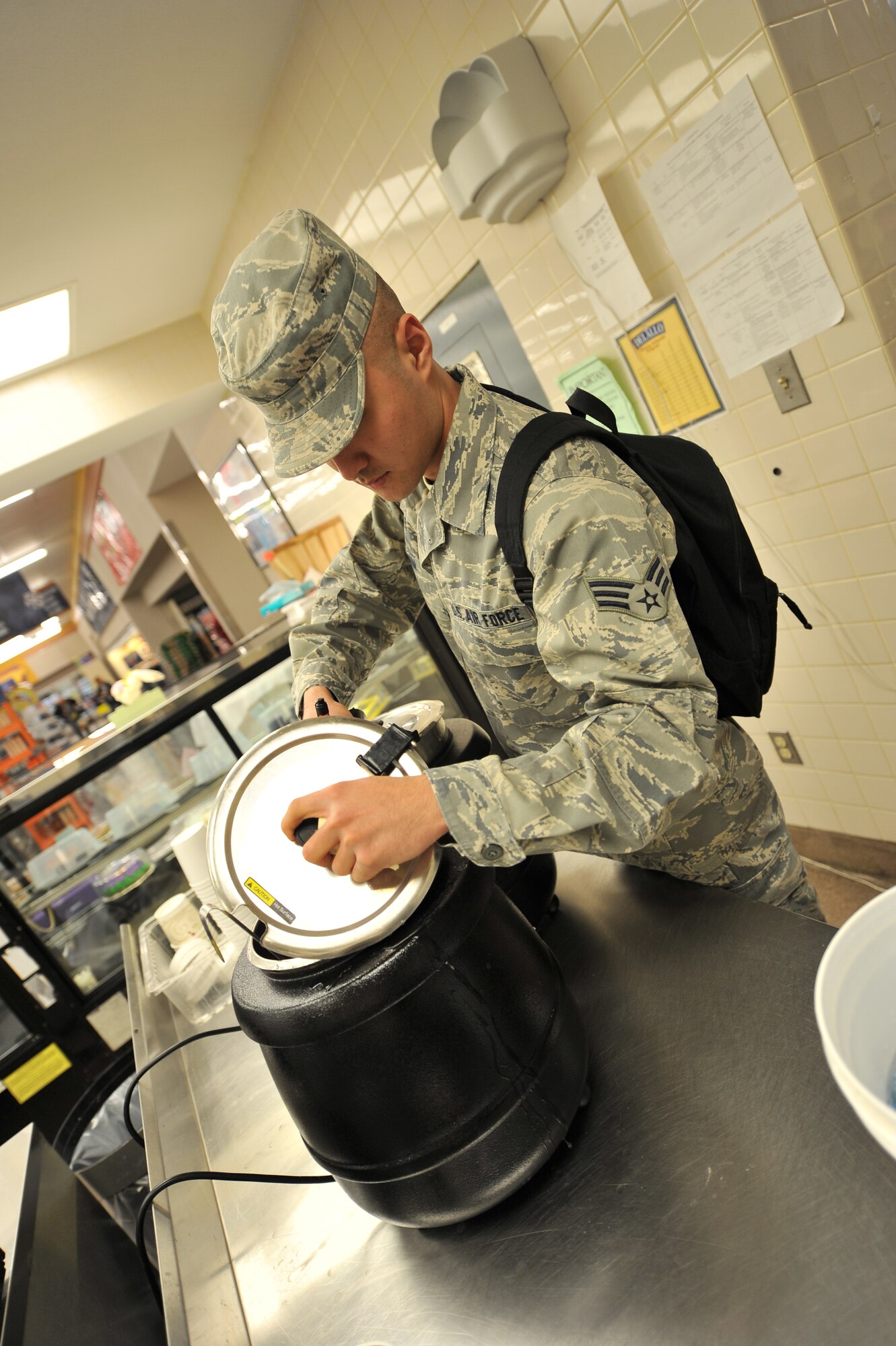 ALTUS AIR FORCE BASE, Okla. – U.S. Air Force Senior Airman Elijah Kim, 97th Medical Group public health technician, checks the temperature of soup during a monthly public health inspection inside the base commissary April 9, 2014. The inspection ensures the continuous compliance with state and federal regulations to always provide safe and edible food products. (U.S. Air Force photo by Senior Airman Dillon Davis/Released)