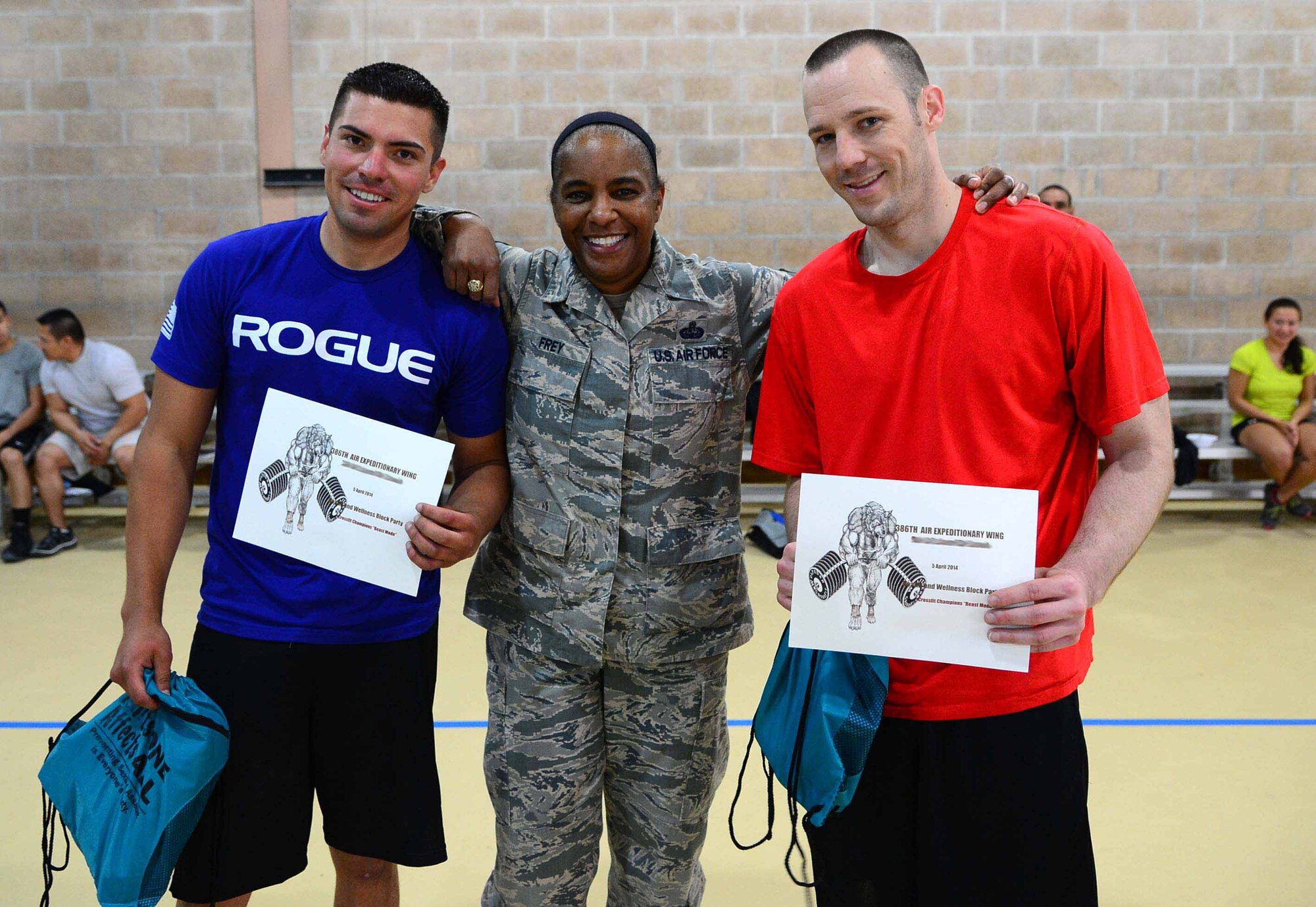 Command Chief Master Sgt. Shelina Frey poses with functional fintess competition winners from the 386th Air Expeditionary Wing during the Wellness Block Party held April 6. Frey visited the 386th AEW as her final stop on her farewell tour throughout the area of responsibility. (U.S. Air Force photo by Senior Airman Desiree Moye)