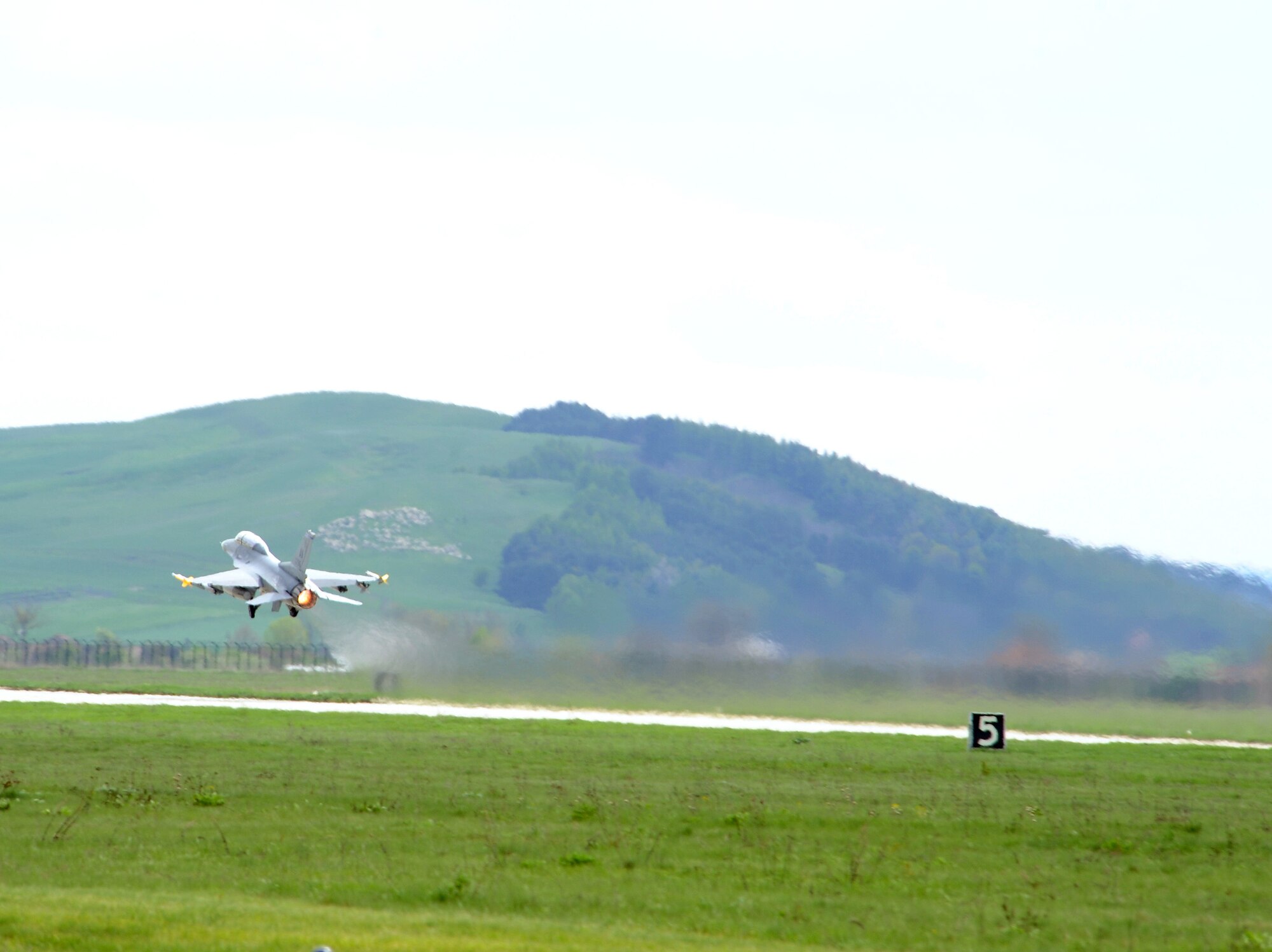 A U.S. Air Force F-16 Fighting Falcon takes off from Campia Turzii, Romania, during Exercise Dacian Viper 2014 on April 10, 2014. The exercise aims to enhance interoperability and readiness through combined air operations, including air-to-air, air-to-ground, and joint tactical air controller training. (U.S. Air Force photo/Staff Sgt. R.J. Biermann)