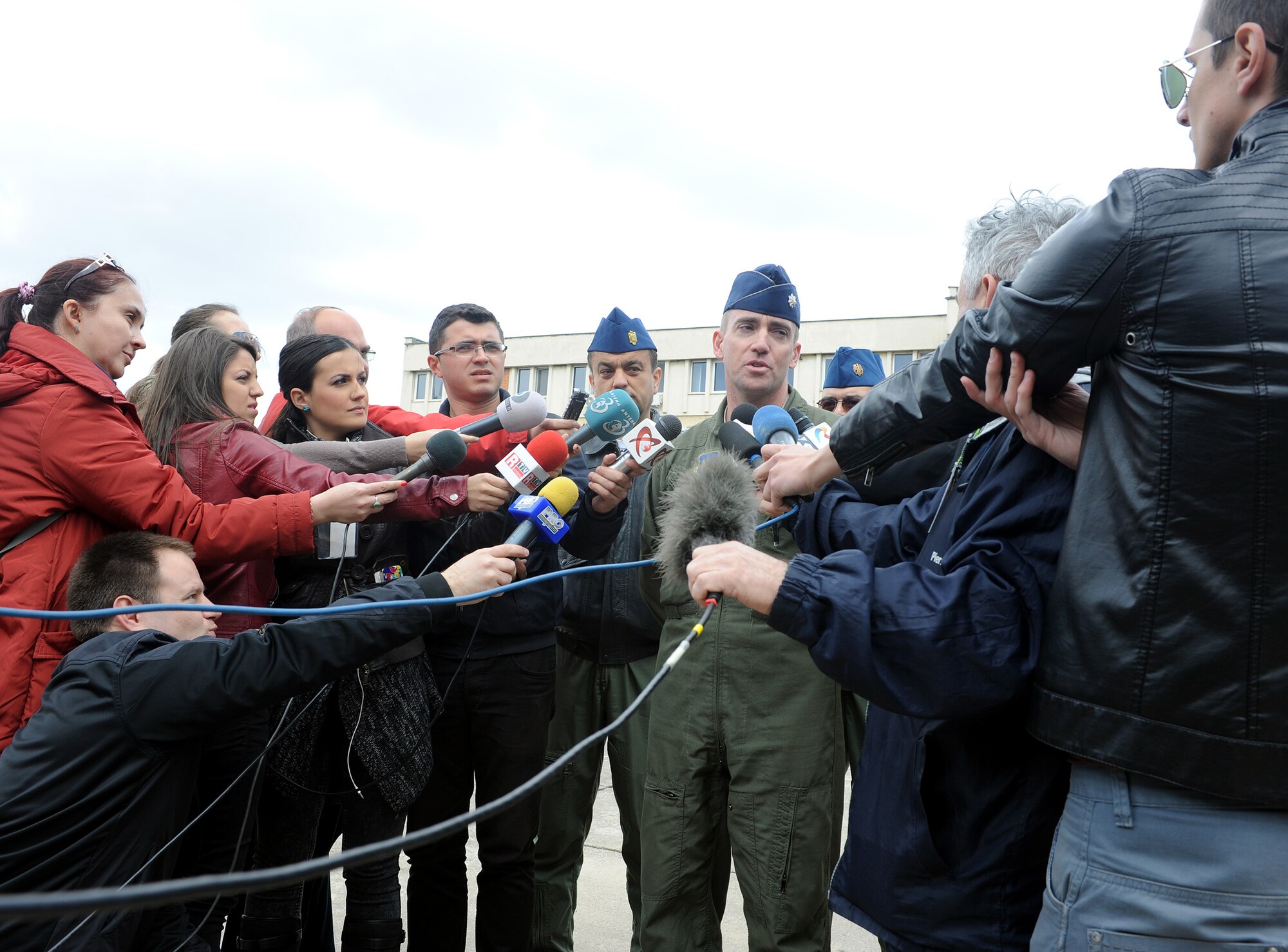 U.S. Air Force Lt. Col. Christopher Austin, 510th Fighter Squadron commander, addresses Romanian reporters after the opening ceremony for Exercise Dacian Viper 2014 at Campia Turzii, Romania April 10, 2014. The exercise will be held from April 10-17, 2014. (U.S. Air Force photo/Staff Sgt. R.J. Biermann)
