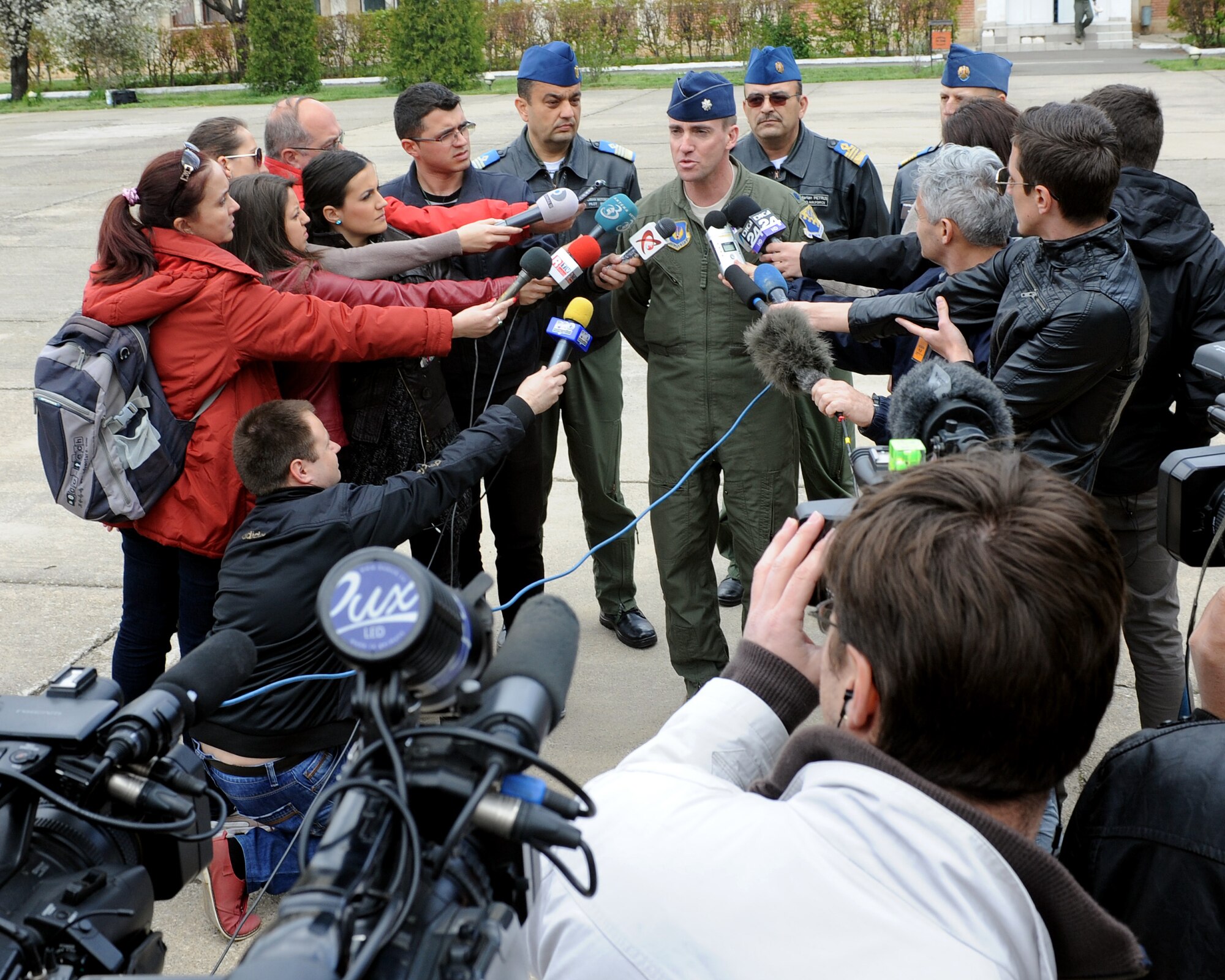 U.S. Air Force Lt. Col. Christopher Austin, 510th Fighter Squadron commander, addresses Romanian reporters after the opening ceremony for Exercise Dacian Viper 2014 at Campia Turzii, Romania April 10, 2014. The exercise will be held from April 10-17, 2014. (U.S. Air Force photo/Staff Sgt. R.J. Biermann)