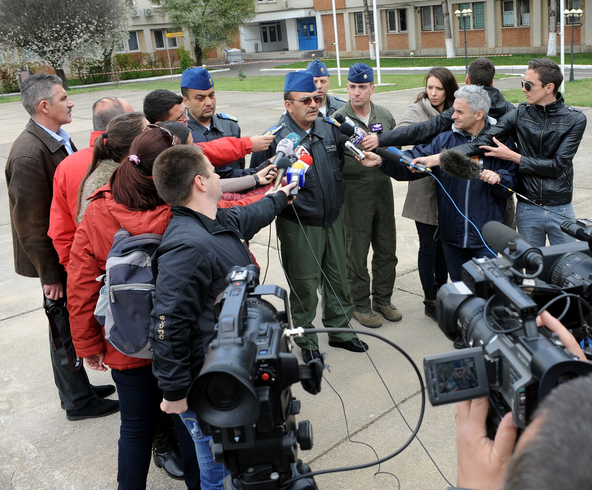 Romanian air force Cmdr. Petrus Marian, 71st Air Base commander, addresses Romanian reporters after the opening ceremony for Exercise Dacian Viper 2014 at Campia Turzii, Romania, April 10, 2014. The exercise will be held from April 10-17, 2014. (U.S. Air Force photo/Staff Sgt. R.J. Biermann)