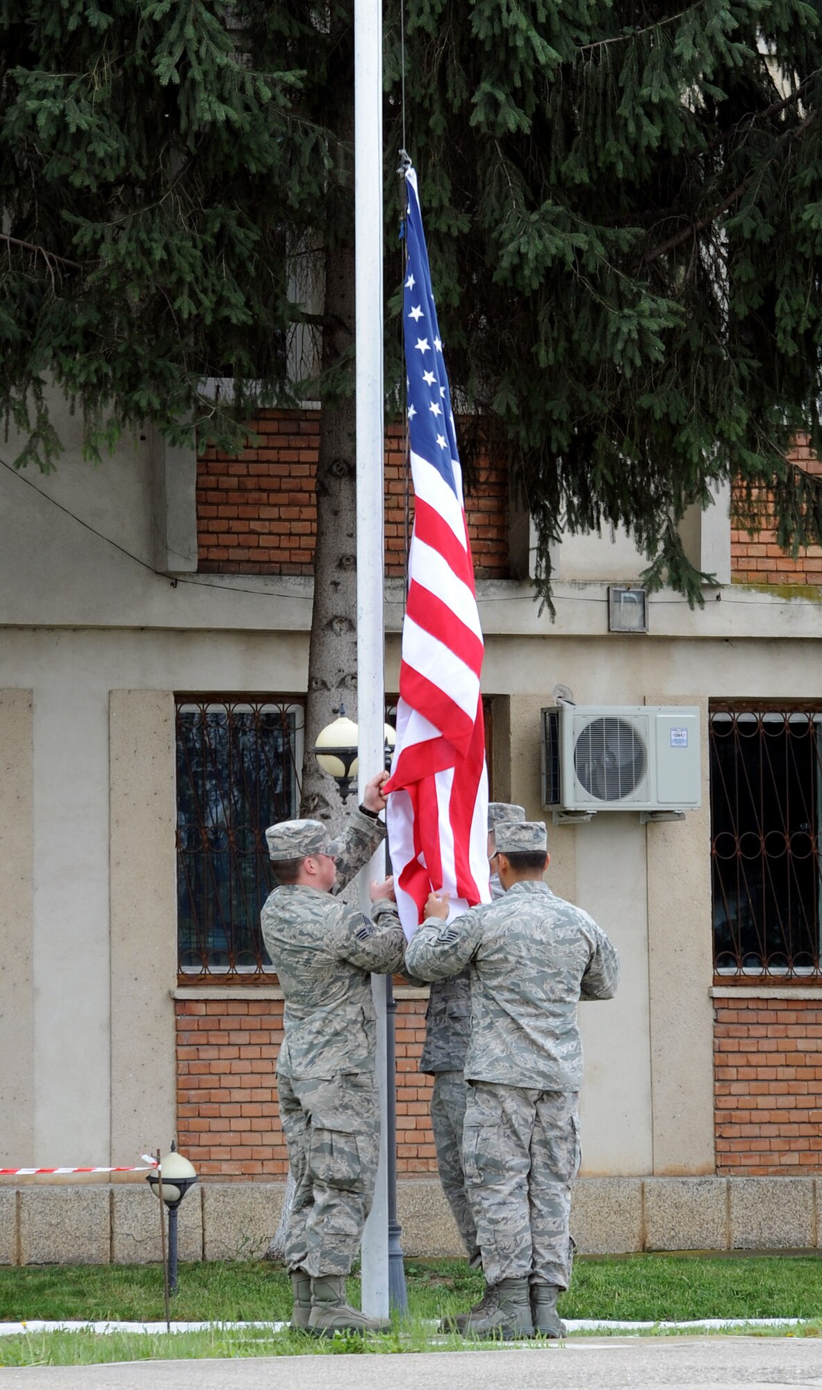 Airmen from the 31st Fighter Wing raise the American flag during the opening ceremony for Exercise Dacian Viper 2014 at Campia Turzii, Romania, April 10, 2014. U.S. and Romanian Airmen met at the 71st Air Base for the ceremony. (U.S. Air Force photo/Staff Sgt. R.J. Biermann)