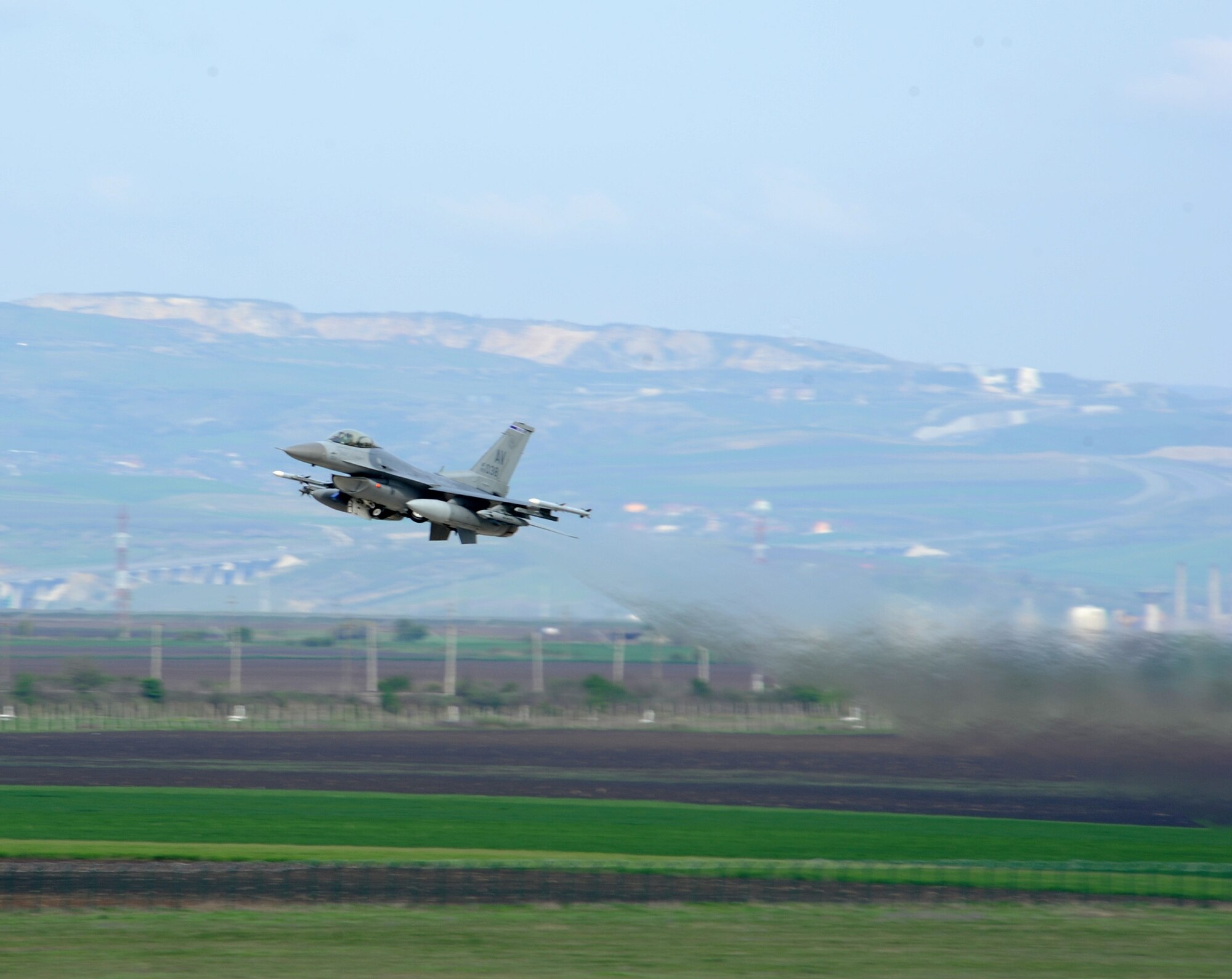 A U.S. Air Force F-16 Fighting Falcon takes off from Campia Turzii, Romania, during Exercise Dacian Viper 2014 on April 10, 2014. The exercise aims to enhance interoperability and readiness through combined air operations, including air-to-air, air-to-ground, and joint tactical air controller training. (U.S. Air Force photo/Staff Sgt. R.J. Biermann)