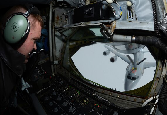 U.S. Air Force Tech. Sgt. Daniel Maas, 351st Air Refueling Squadron instructor boom operator from Hoskins, Neb., pumps fuel into a French air force E-3 Sentry serving in a NATO capacity April 10, 2014, over Eastern Europe. The 351st ARS is the only aerial refueling squadron in the U.S. Air Forces in Europe, serving both Europe and Africa. (U.S. Air Force photo by Airman 1st Class Dillon Johnston/Released)