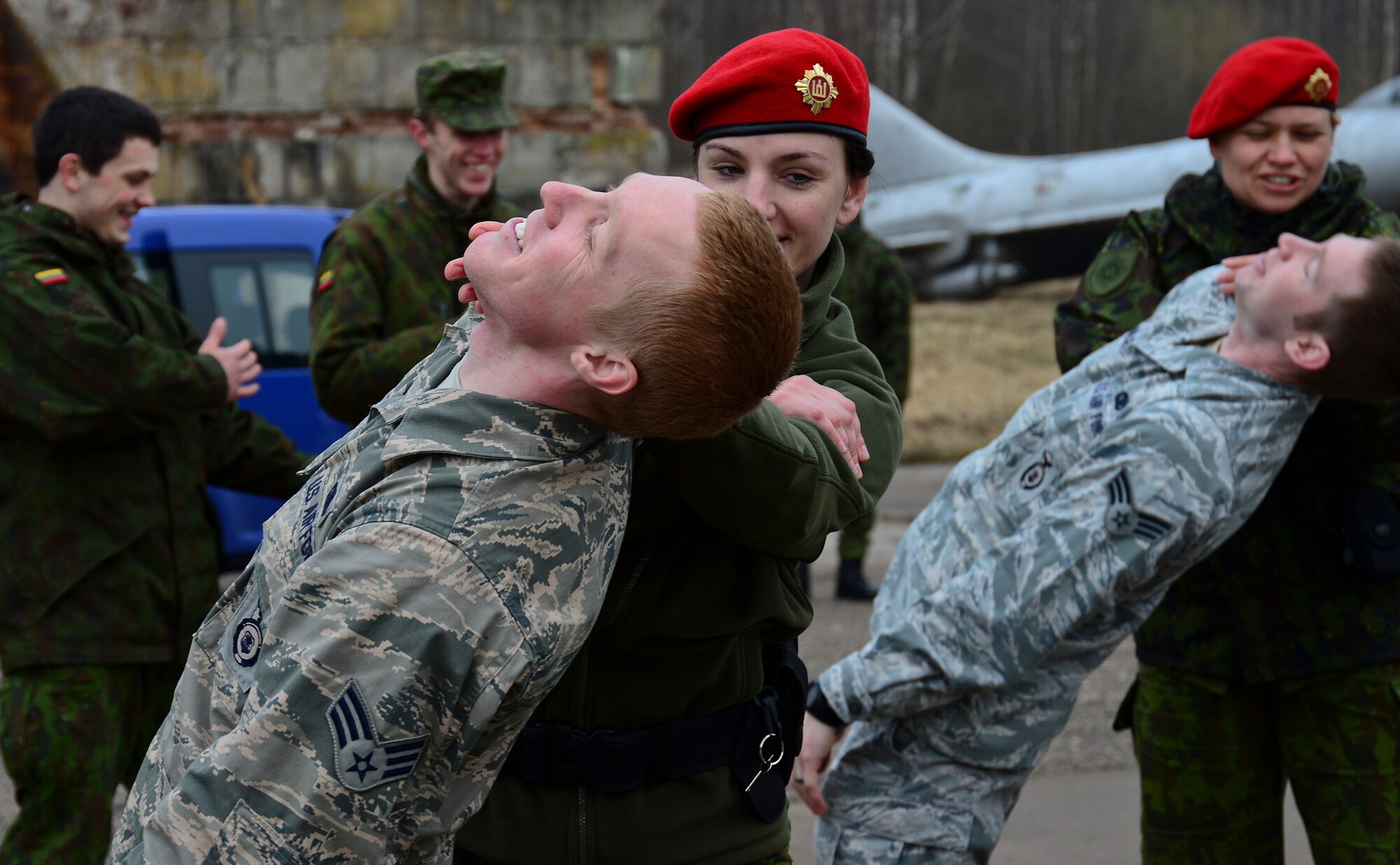 Security Forces members assigned to the 48th Air Expeditionary Group and Lithuanian air force military police members practice the use of, mechanical advantage control hold techniques during combined force training with Lithuanian air force military police at Šiauliai Air Base, Lithuania, April 8, 2014, to build partnerships and enhance cooperation. These techniques are a non-lethal use of force tool employed by security forces to control or subdue a subject until the situation has been de-escalated.  (U.S. Air Force photo by Airman 1st Class Dana J. Butler/Released)  