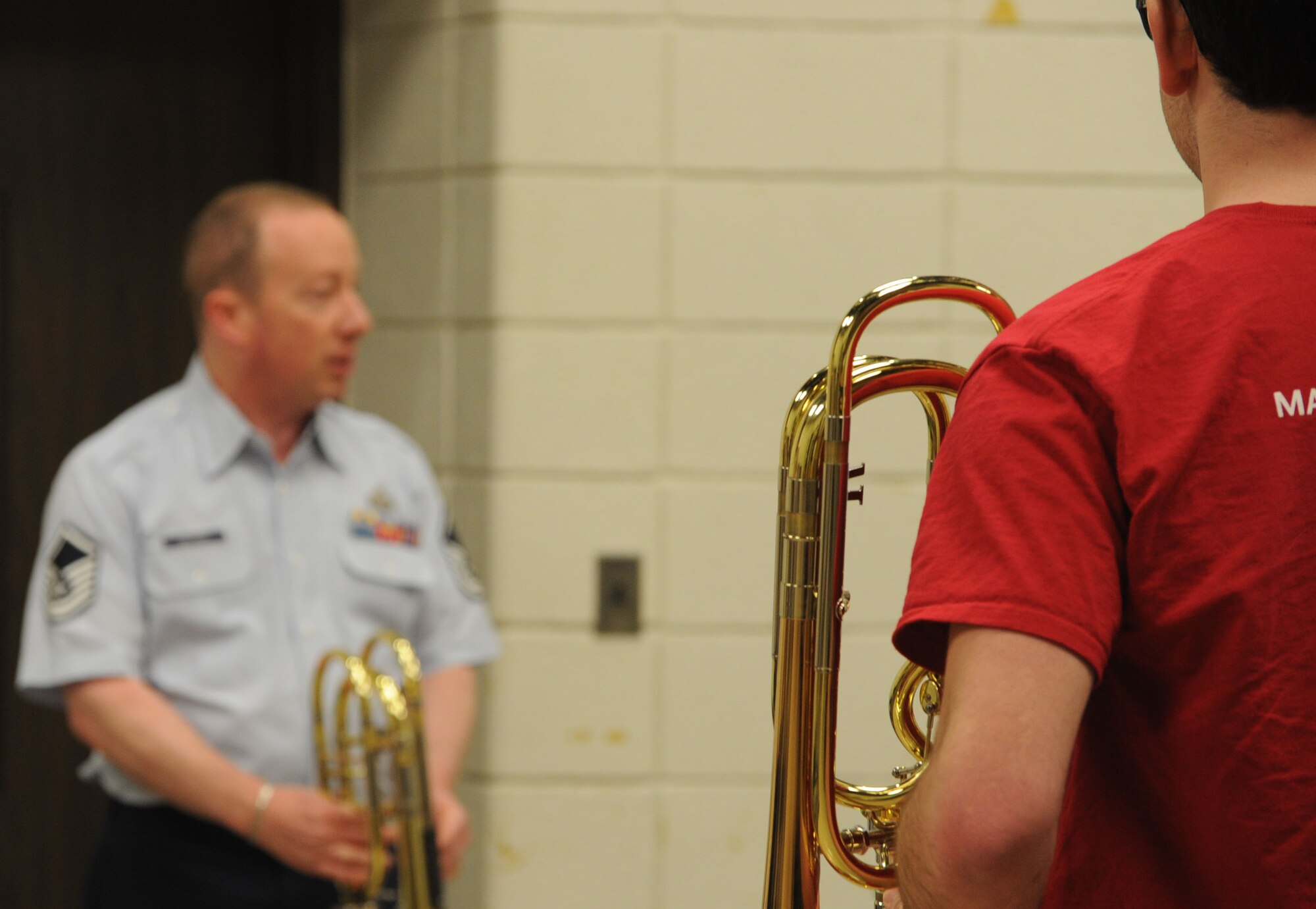 Master Sgt. Jay Heltzer answers questions from a group of music students during The U.S. Air Force Band’s Advancing Innovation Through Music Individual Instrumental Clinic at Eastern Michigan University in Ypsilanti, Mich., April 9, 2014. Heltzer, a native of Sherman Oaks, Calif., is a bass trombonist with the Concert Band, the U.S. Air Force Band’s largest ensemble. (U.S. Air Force photo/Master Sgt. Tammie Moore)