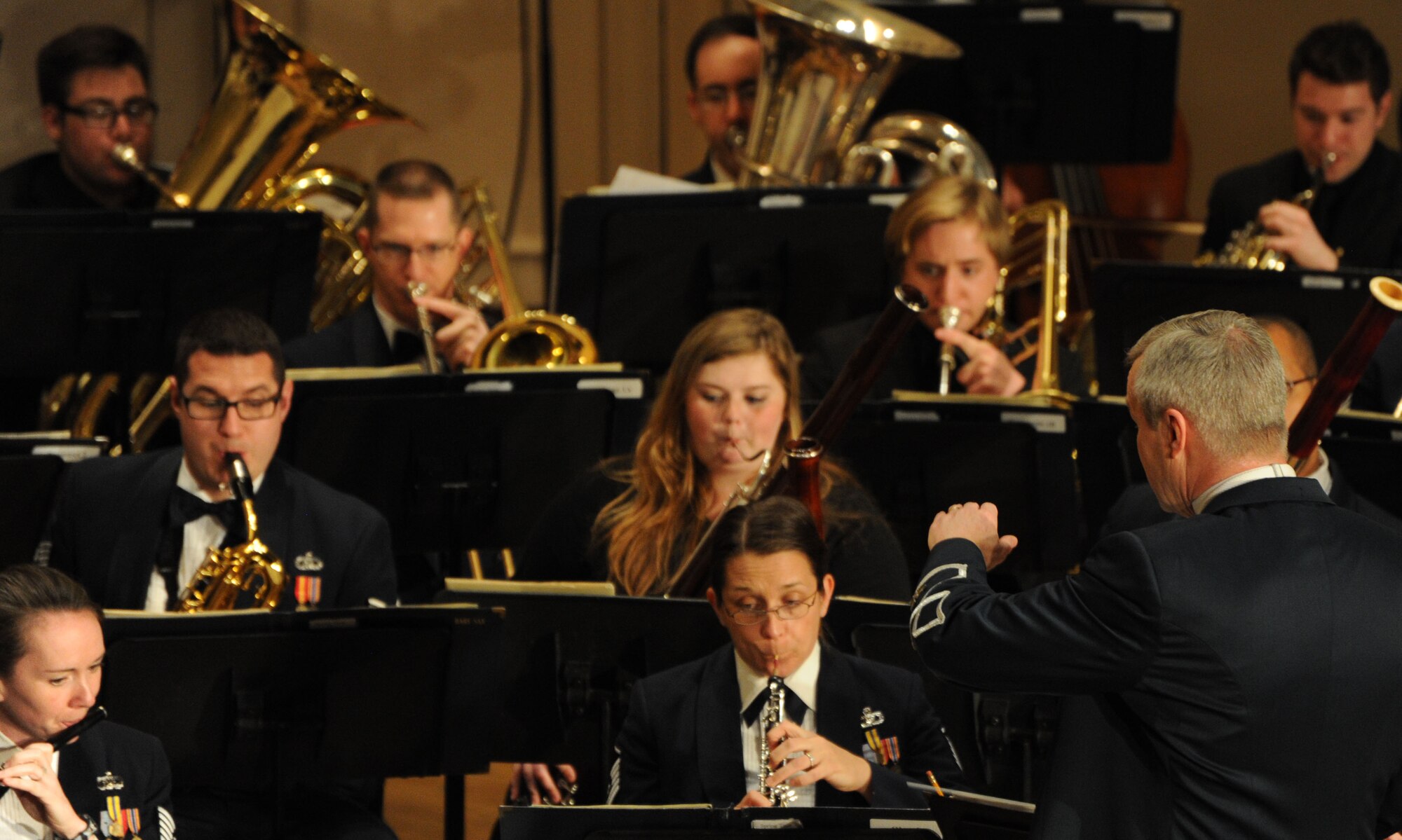 Col. Larry Lang conducts Eastern Michigan University students along with Concert Band Airmen during The U.S. Air Force Band’s performance at EMU in Ypsilanti, Mich., April 9, 2014. The EMU students participated in an Advancing Innovation Through Music Individual Instrumental Clinic led by the Band Airmen prior to the evening performance. Lang, a native of El Paso, Texas, is the commander and conductor of the Band. (U.S. Air Force photo/Master Sgt. Tammie Moore)