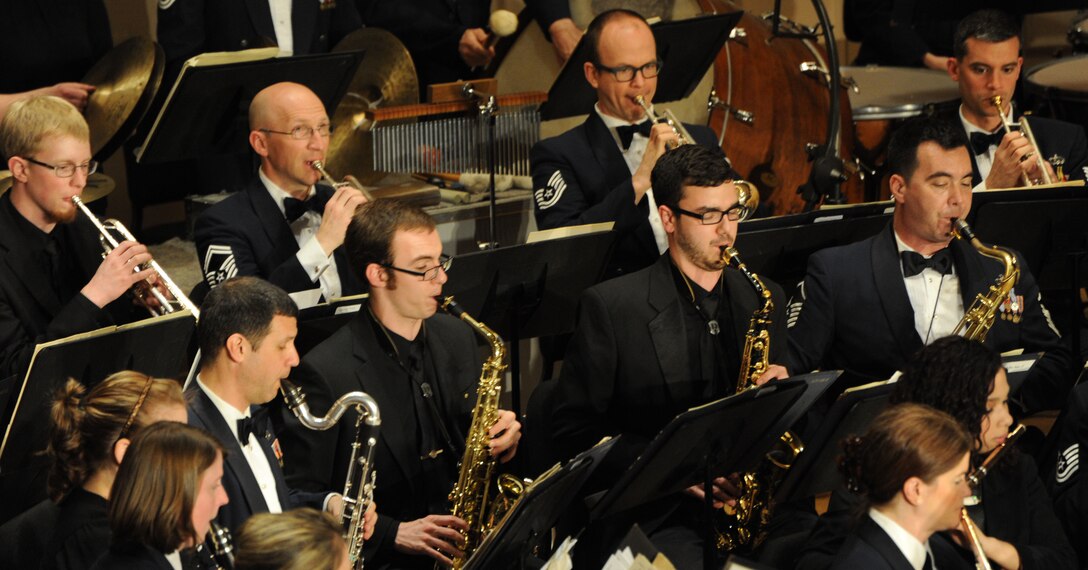 Eastern Michigan University students perform along with Concert Band Airmen during The U.S. Air Force Band’s performance at EMU in Ypsilanti, Mich., April 9, 2014. The EMU students participated in an Advancing Innovation Through Music Individual Instrumental Clinic earlier in the day. (U.S. Air Force photo/Master Sgt. Tammie Moore)