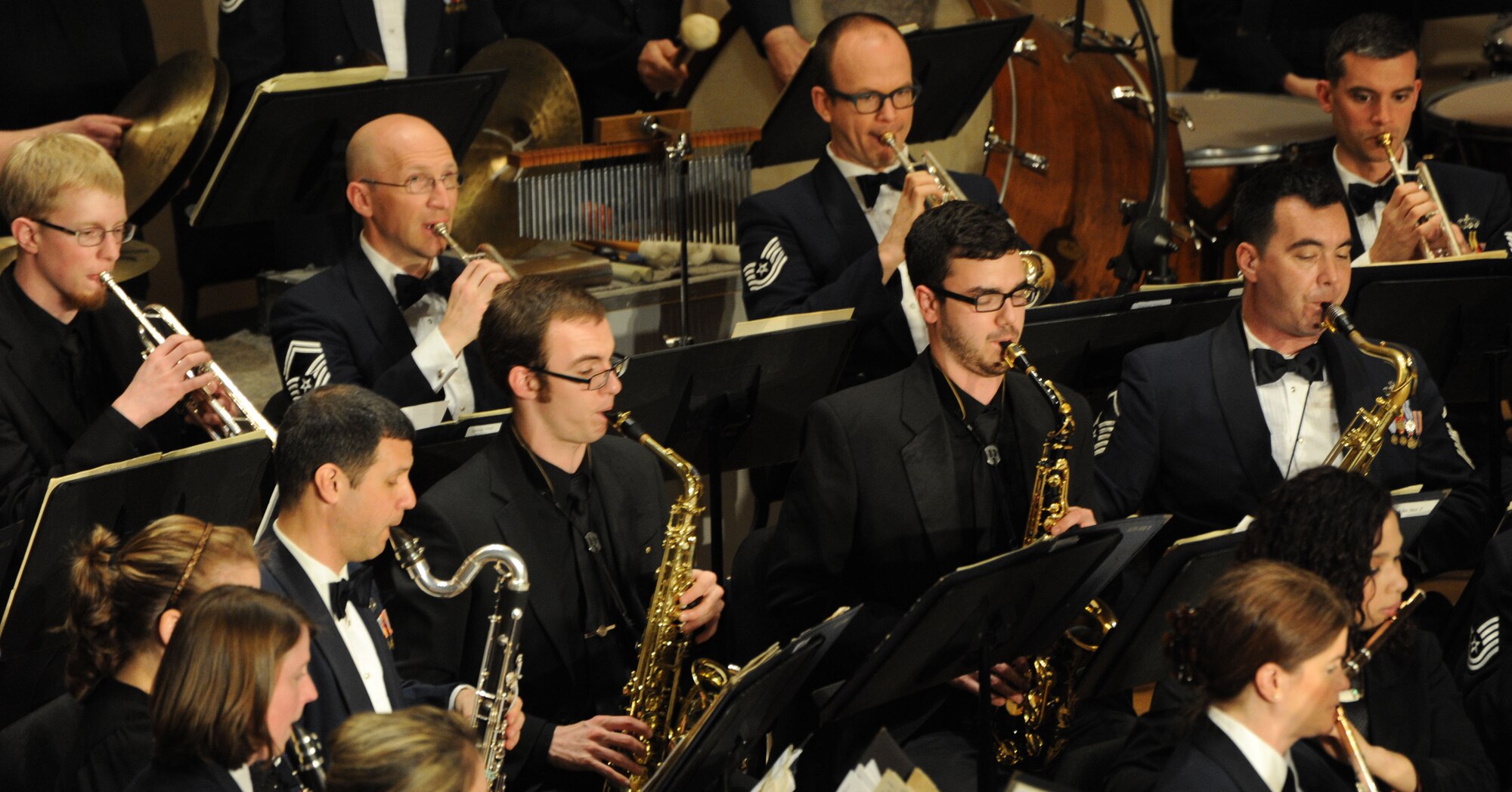 Eastern Michigan University students perform along with Concert Band Airmen during The U.S. Air Force Band’s performance at EMU in Ypsilanti, Mich., April 9, 2014. The EMU students participated in an Advancing Innovation Through Music Individual Instrumental Clinic earlier in the day. (U.S. Air Force photo/Master Sgt. Tammie Moore)