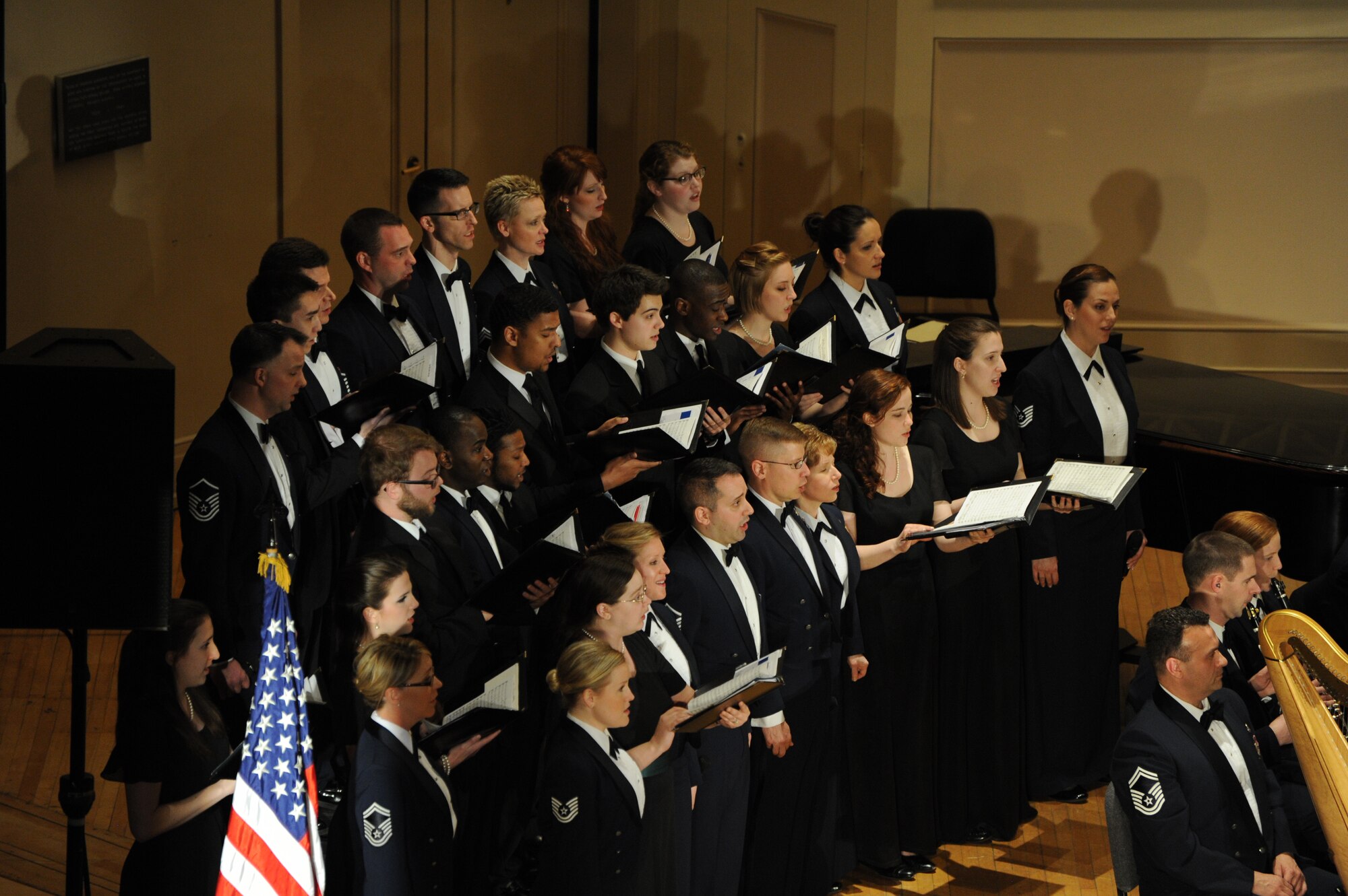 Eastern Michigan University students perform along with the Singing Sergeants and Concert Band Airmen during The U.S. Air Force Band’s performance at EMU in Ypsilanti, Mich., April 9, 2014. The EMU students participated in an Advancing Innovation Through Music Individual Instrumental Clinic earlier in the day. (U.S. Air Force photo/Master Sgt. Tammie Moore)