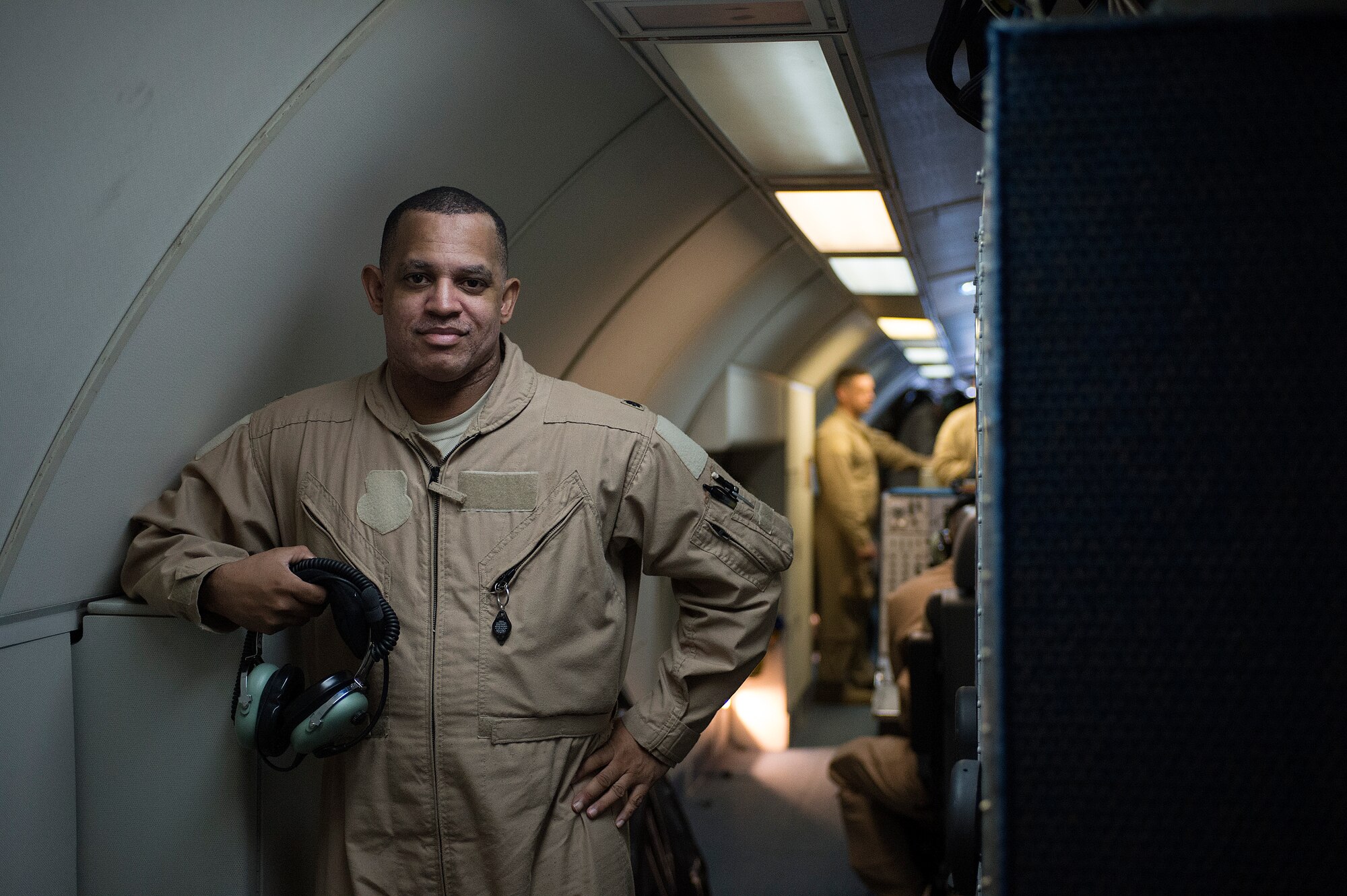 Air Force Lt. Col. (Dr.) Robert Craig-Gray, 380th Expeditionary Medical Group deputy commander and chief of aerospace medicine, poses for a photo on an E-3 Sentry after exceeding 1,000 flying hours, during a combat sortie flown in support of Afghanistan Presidential Elections, April 5, 2014, over Afghanistan. He reached this feat during his 301st sortie. (U.S. Air Force photo by Tech. Sgt. Jason Robertson/Released)