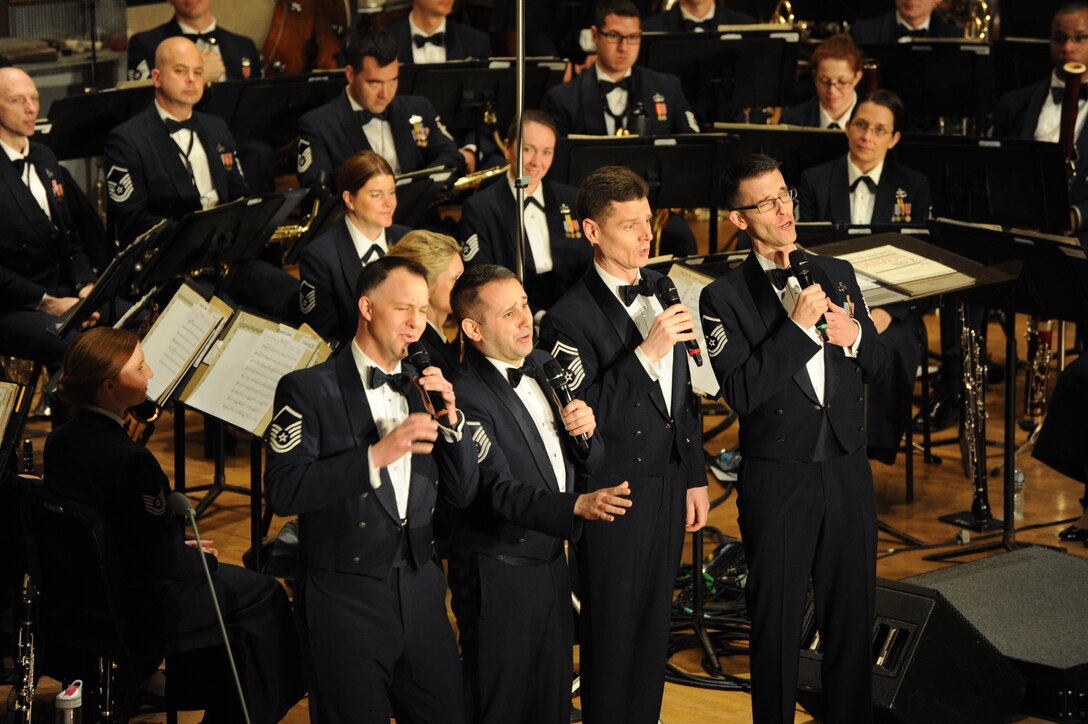 Airmen from the Singing Sergeants perform “Coney Island Baby” during the U.S. Air Force Band’s show at Eastern Michigan University in Ypsilanti Mich., April 9, 2014. The Singing Sergeants, the official chorus of the U.S. Air Force, is one of the world's most versatile and traveled choral organizations. The group originally formed in 1945 from the ranks of the United States Army Air Forces Band. (U.S. Air Force photo/Master Sgt. Tammie Moore)