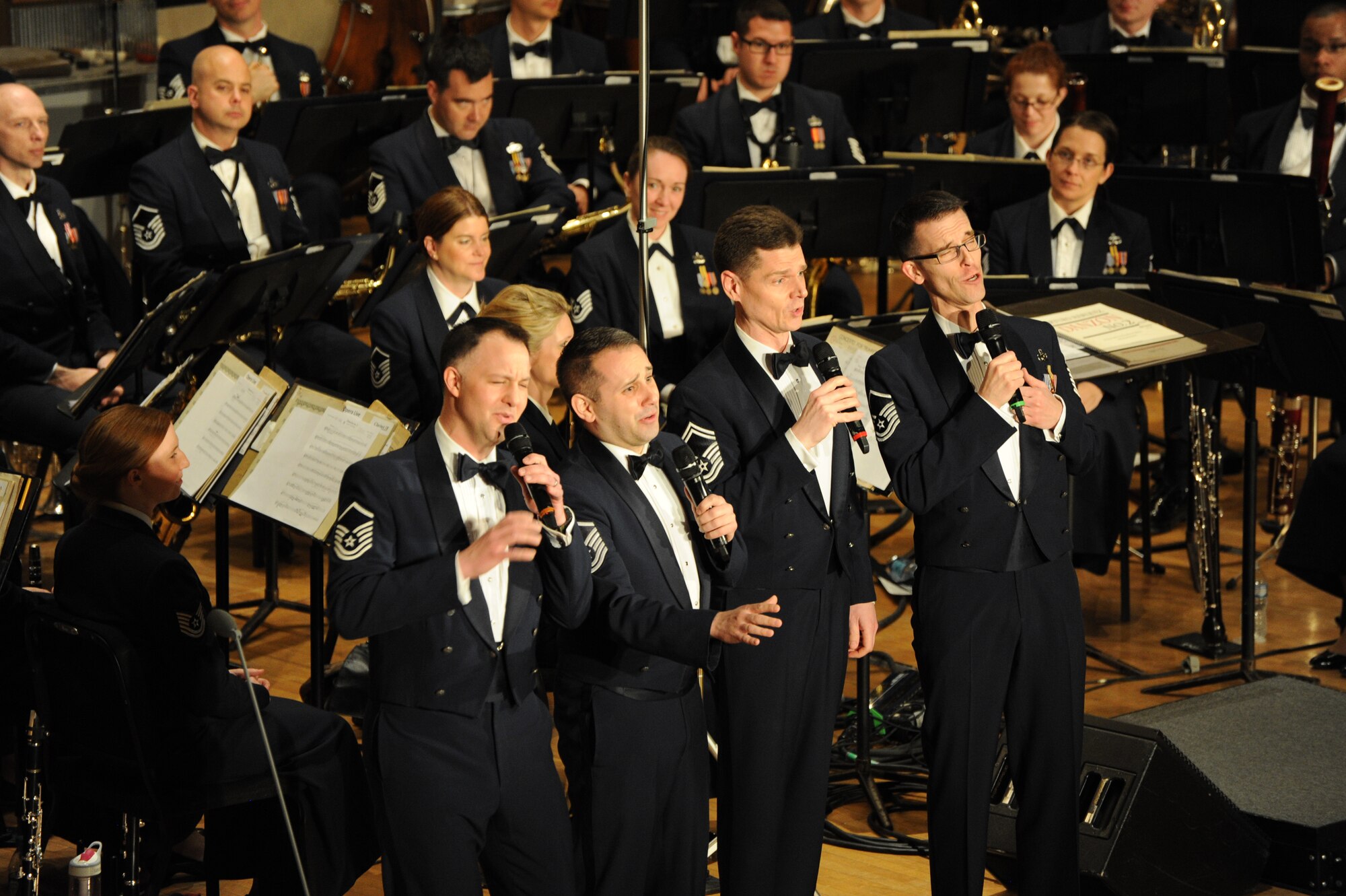Airmen from the Singing Sergeants perform “Coney Island Baby” during the U.S. Air Force Band’s show at Eastern Michigan University in Ypsilanti Mich., April 9, 2014. The Singing Sergeants, the official chorus of the U.S. Air Force, is one of the world's most versatile and traveled choral organizations. The group originally formed in 1945 from the ranks of the United States Army Air Forces Band. (U.S. Air Force photo/Master Sgt. Tammie Moore)