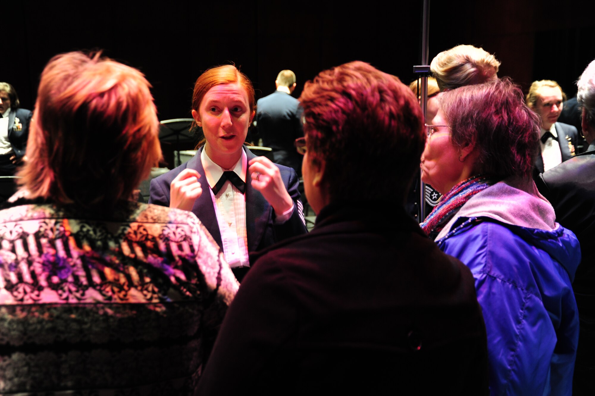Tech. Sgt. Kristin Bowers, U. S. Air Force Band clarinetist, talks to audience members after the Band’s performance at Monroe County Community College in Monroe, Mich., April 8, 2014. This performance is part of the Band’s 2014 Spring Tour across Illinois, Indiana and Michigan. (U. S. Air Force photo/Airman 1st Class Joshua R. M. Dewberry)