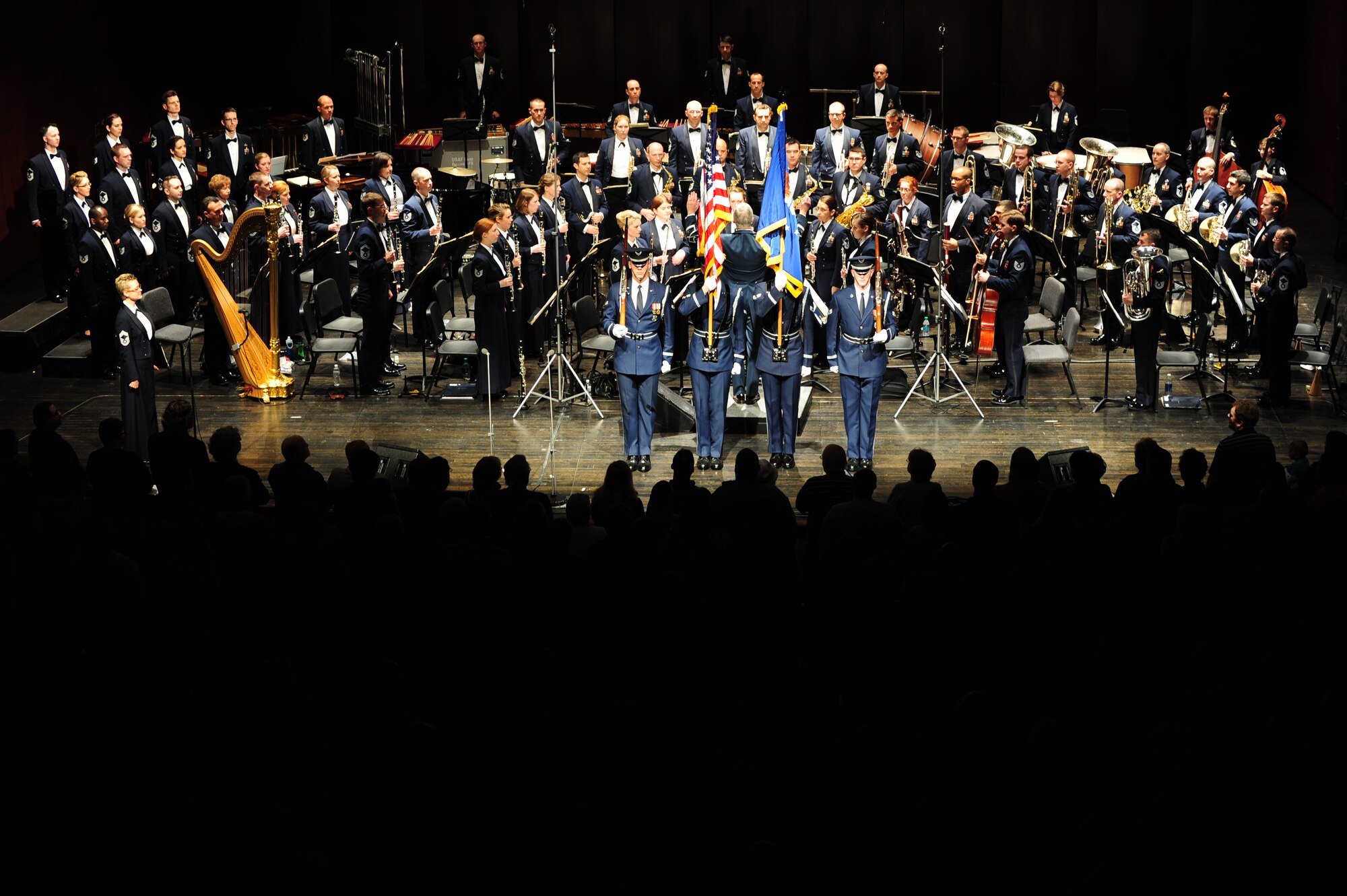 Members of the audience stand for The U. S. Air Force Band’s “Stars and Stripes Forever” performance at Monroe County Community College in Monroe, Mich., April 8, 2014. The performance is part of the Band’s 2014 Spring Tour across Illinois, Indiana and Michigan. (U. S. Air Force photo/Airman 1st Class Joshua R. M. Dewberry)