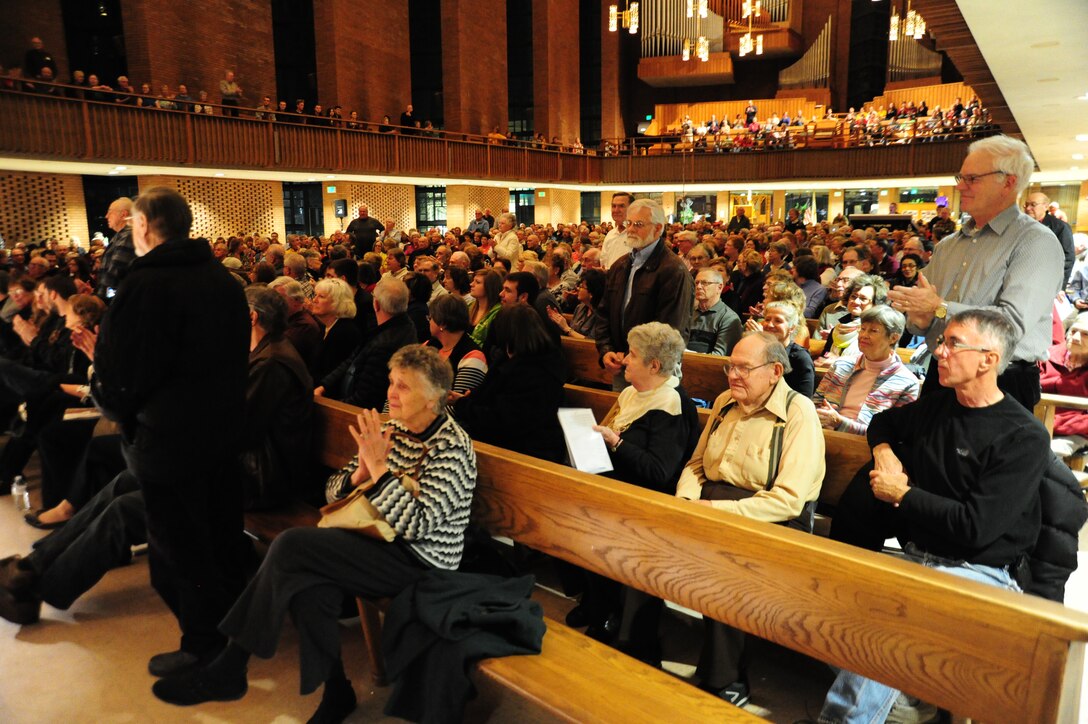 Military veterans in the audience stand for applause and recognition of their prior service during a closing performance by the U. S. Air Force Band Valparaiso University’s Chapel of Resurrection in Valparaiso, Ind., April 7, 2014. Each show ends with the Band and audience recognizing veteran’s service to their country. (U. S. Air Force photo/Airman 1st Class Joshua R. M. Dewberry)
