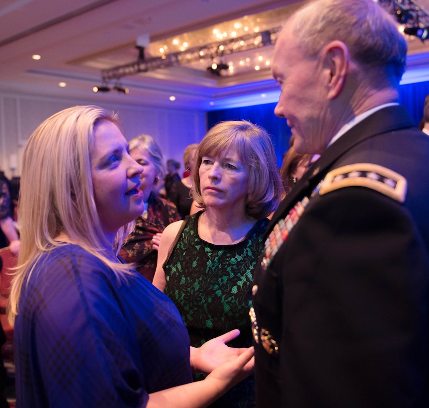 Army Gen. Martin E. Dempsey, right, chairman of the Joint Chiefs of Staff, and his wife, Deanie, center, talk with Jennifer Adam, a cancer survivor and the mother of Gage A. Dabin, Air Force child of the year, during Operation Homefront’s 6th Annual Military Child of the Year Awards gala in Arlington, Va., April 10, 2014.