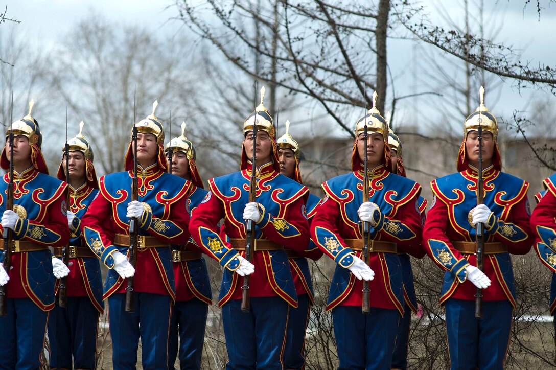 Mongolian soldiers present arms to U.S. Defense Secretary Chuck Hagel at an honor cordon at the Mongolian Ministry of Defense in Ulaanbaatar, Mongolia, April 10, 2014.  